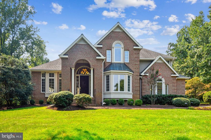 Tour This Magnificent Home Online by Clicking on the MOVIE REEL ICON LOCATED ABOVE THE PHOTO OF THE HOME  or call for your personal in person tour.    One of a kind 4 bedroom, 4.5 bathroom, 5,996 finished SF custom home on 1.19 parklike acres with gorgeous heated in-ground pool with three waterfalls  is now being offered for sale.  Relax the minute you turn into Belvoir Farms, a beautiful community of 92 estate homes with community pier/boat slips,  boat ramp, kayak, tennis and playground just minutes from downtown Annapolis and a very easy commute to Baltimore and DC.  Love your gracious foyer with curved staircase,  beautiful oversized and abundant windows with transoms , unique architectural lines, and hardwood flooring throughout main and upper levels.  Spacious gourmet kitchen with center island, granite counters and SS appliances is open to the family room with wood burning fireplace and the gorgeous screened porch overlooking the heated pool with three cascading waterfalls--perfect for entertaining!  Unwind in your tranquil owner's suite complete with sitting room, gas fireplace, lavish bath with soaking/jetted tub and separate oversized shower and custom walk in closet large enough for everyone's clothes!   Guests will relax in their bedroom with private bathroom while the two other bedrooms with Jack and Jill  bathroom are perfect for your family.    All ages will enjoy the large lower level rec room with gas fireplace, built in shelving and bar along with an exercise room, full bathroom and spacious storage room.   Listen to the birds as you float on your raft in your heated salt water pool surrounded by blooming perennials and cascading waterfalls.   Yes...you do deserve this.  Home has been lovingly maintained so that you will only need to unpack and enjoy.  Welcome Home to 1211 Algonquin Road!    Please click on the movie reel for your personal tour of this magnificent home.