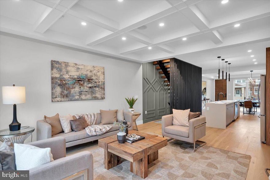 Fountain Street homes are a collection of luxury new construction residences nestled on a quiet block in Roxborough, close to Ridge Ave and Main Street Manayunk. Each home offers 4 beds, 4 baths, private outdoor space adjacent to your parking space, a roof deck, and 5 out of the 6 homes have a finished basement. Unique character and high-end finishes are featured throughout, starting on the open and airy main level, where the large windows fill the living room with natural light. At the center is a gleaming gourmet kitchen fitted with custom cabinetry, and chef's line appliances. Off the dining room at the rear, you'll find a patio, perfect for grilling and al-fresco dining, and a dedicated 1-car parking spot directly behind the property. On the finished lower level, there's an expansive bonus room, ideal for a gym, playroom, or den, along with a full bathroom. Up on the second level, there's a bedroom suite with tall windows and an attached full bathroom at the front, another bathroom off the hall, and a spacious bedroom at the rear. The third level is dedicated to the primary suite which boasts ample sunlight and has a private terrace, two walk-in closets, and a stunning, spa-like ensuite bathroom. Also on the third floor is a wet bar with sink that leads to the peaceful roof deck displaying picturesque tree-top views. In addition to everything inside, these homes are only a block from the shops and markets on Ridge Ave and 5 minutes from the popular restaurants and lively entertainment on Main St. There's also easy access to I-76, Henry Ave, and Montgomery County. Taxes and square footage are the responsibility of the buyer to have verified. Photos are of the model home and depict some upgrades and may not portray actual finishes.