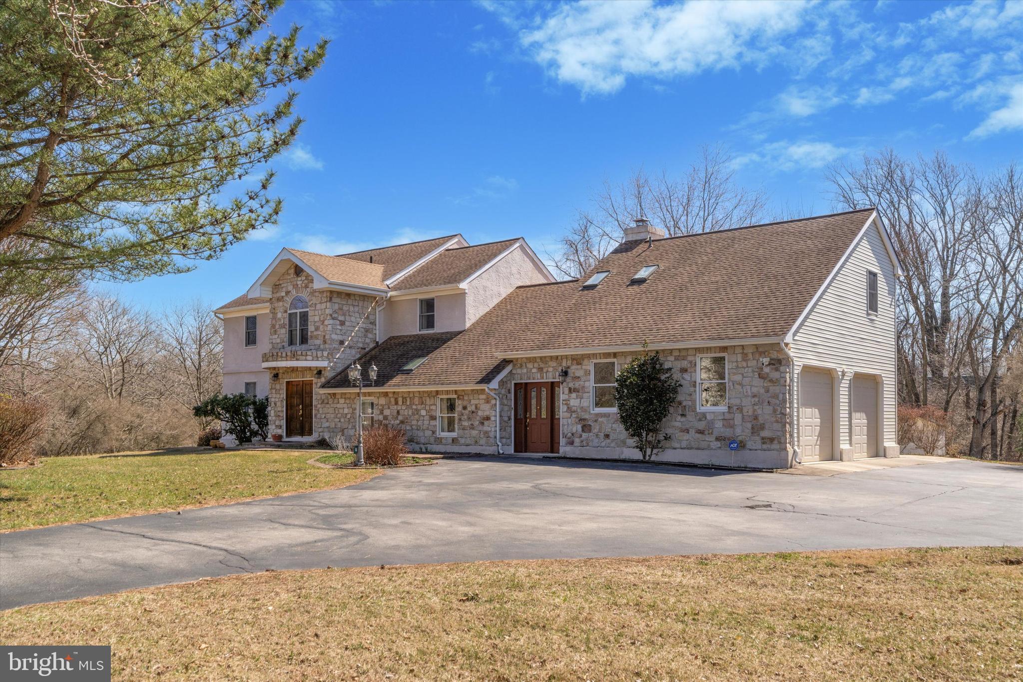This exceptional custom-built home spans 4,500 sq. ft. of living space, set on 1.29 acres in a picturesque, tree-lined neighborhood. With wide streets and distinctive homes, the property is ideally located within walking distance of Whole Foods, Wegmans, and various shops. Just a few miles from Garnet Valley’s schools and Delaware, this home offers both convenience and charm.
Designed with meticulous attention to detail, the home boasts a private office with a separate entrance, a flexible in-law suite or second office above the two-car garage, and an array of custom features personally selected by the owners during construction. Out of the 4,500 sq. ft. of living space, 3,795 sq. ft. are on the main two floors of the house, and the remainder is on the lower level.
The interior is enhanced by elegant arched doorways, vaulted ceilings, and a garage with extra-high ceilings for added convenience. One of the standout features of this home is its structural integrity. The main living areas benefit from 12-inch spacing between the joists (as opposed to the standard 16-inch), ensuring increased strength and durability.
The kitchen was renovated in 2011, featuring solid wood cabinetry and premium appliances, including a double oven—perfect for culinary enthusiasts. The roof and both HVAC systems (dual-zone) were also replaced in 2011. Upstairs, you'll find four spacious bedrooms, including a master suite, as well as a conveniently located laundry closet. The lower level offers a fifth bedroom with a private full bath and a walkout to the backyard, ideal for guests or extended family. The in-law suite, which can also be used as an office, is located above the garage and includes a bedroom, kitchenette, and a full bathroom.
The current owners connected the home to the public sewer system, while continuing to enjoy the natural water from the house's well. They have also installed a new filtering system for the well in recent years, despite the availability of a public water line on the street.
A visit to this home is a must to truly appreciate its unique layout and multi-use rooms. Be sure to take a drive through the neighborhood, where the peaceful, tree-lined streets provide a serene and inviting atmosphere.