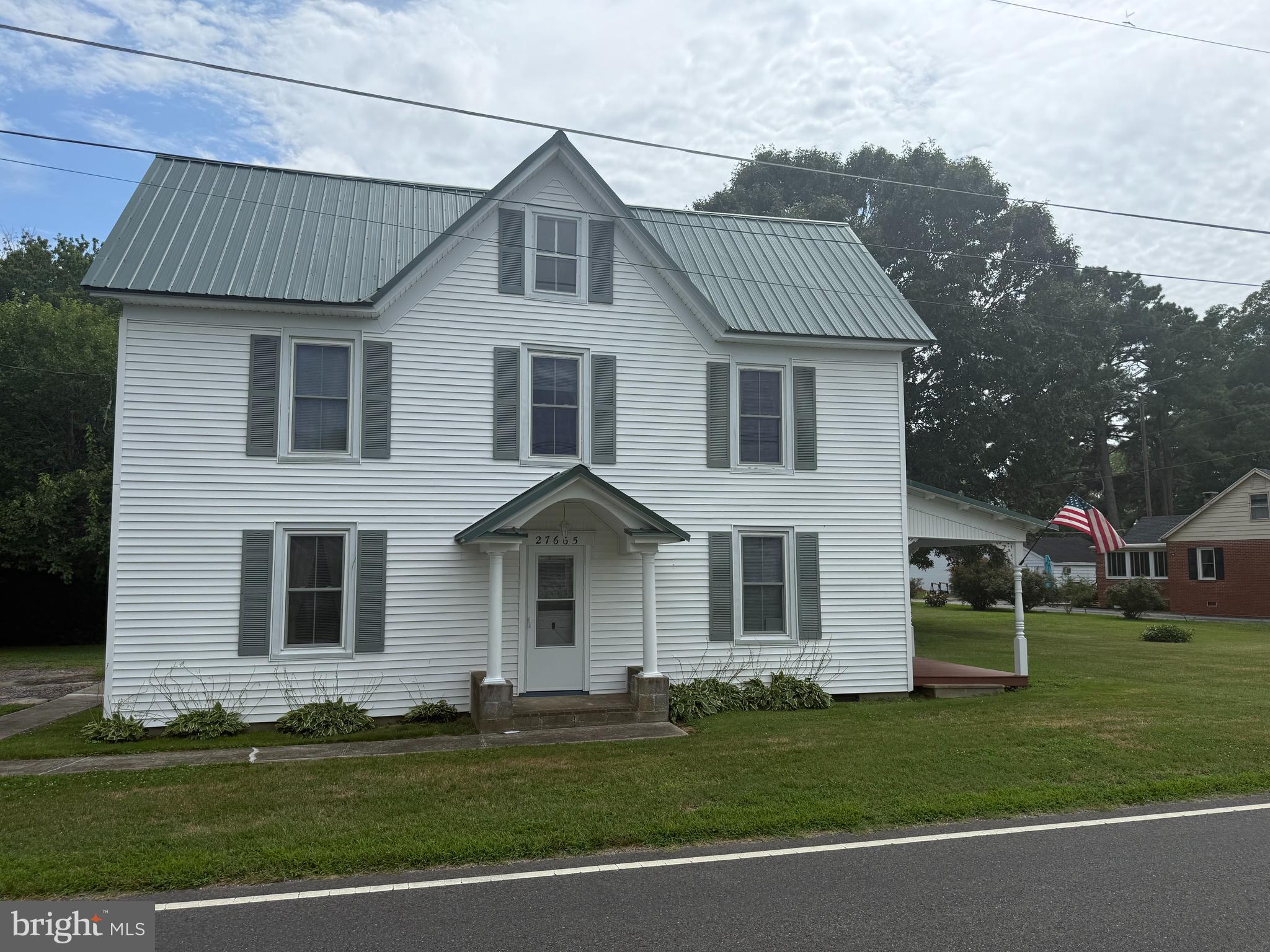 Charming Farmhouse with Modern Updates on 1 Acre. Step into a perfect blend of old-world charm and modern convenience in this 3-bedroom, 1.5-bath farmhouse, situated on a spacious 1-acre lot. Thoughtfully updated since 1997, this home features a metal roof (2021), updated plumbing and electrical, a new furnace (2021/2022), and a refrigerator (2023) for peace of mind.
The inviting front porch is a great place to relax and take in the peaceful country setting. Inside, you'll find a cozy living room and dining area with warm, welcoming character. The second floor features three bedrooms and a full bath. One of the bedrooms has access to a private balcony overlooking the yard. Partially furnished and filled with charm, this home is ideal for those seeking a quiet retreat with a touch of history and the benefit of modern conveniences. Call for your personal tour.