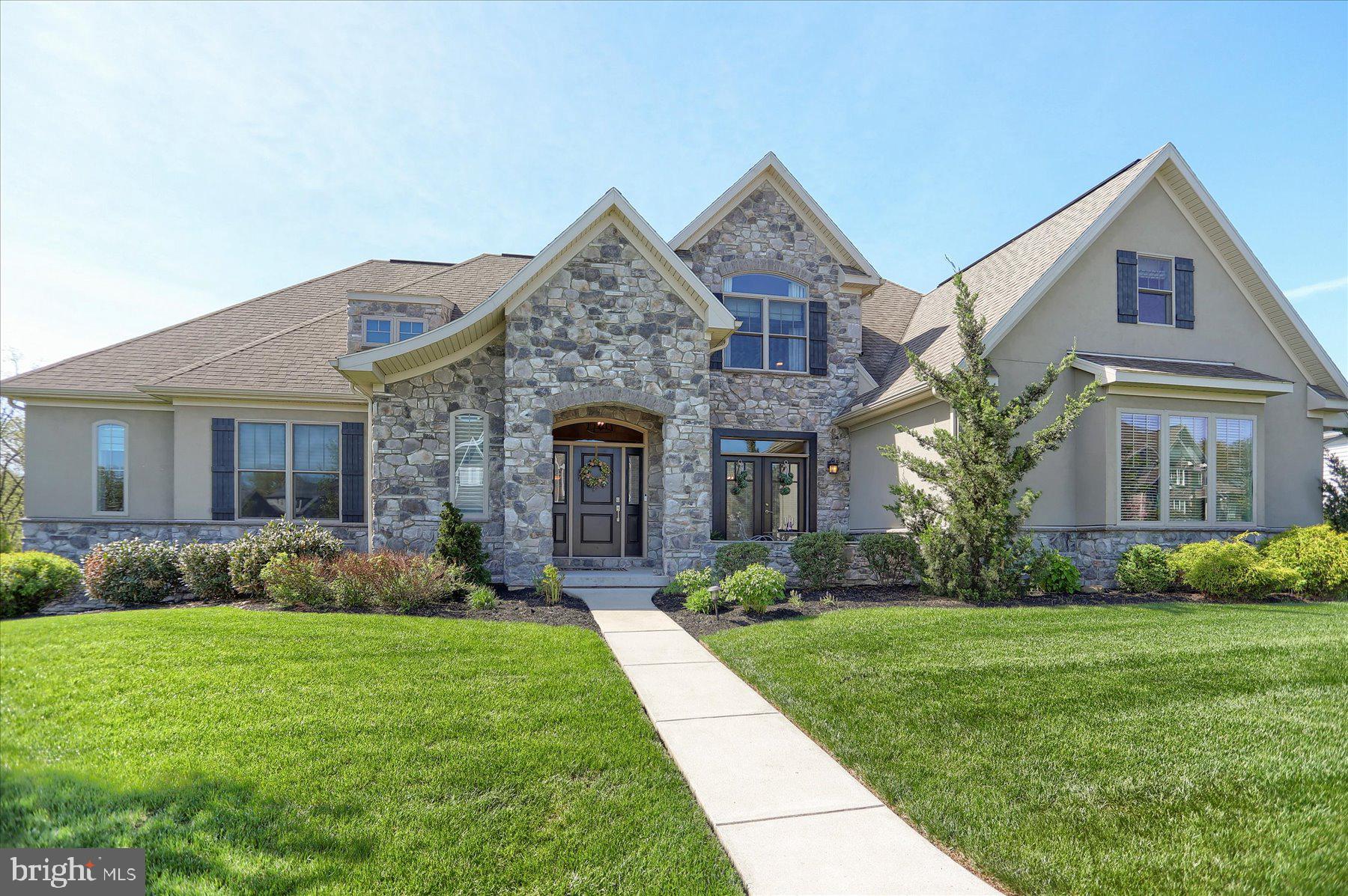 Welcome to this gorgeous stunning Ionni Builders custom home with three levels and over 6100 sq. ft of living space. This quiet neighborhood with friendly neighbors is a “cul-de-sac neighborhood” which only has only 35 custom-built homes in Central Dauphin School District. This beautiful home finished with stone and stucco is situated on a 1/2-acre lot.
As you enter the front door through the foyer which has 18’ high ceilings, you will be “WOWED” with breathtaking picturesque views! The first floor boasts a wide open 22’ x 35’ Great Room with beautiful bamboo hardwood floors & crown molding throughout, 9’ high ceilings, a gas fireplace, an oversized kitchen with Shiloh custom cabinets, vaulted ceiling, island, granite countertops, and a 9’x7’ walk-in pantry which is a cook’s delight & sliding glass doors to a beautiful deck. Plus, right off the kitchen is the Laundry Room/Mudroom offering generous counter space as well with porcelain floors. This segways to one 2-car garage & one 1-car garage. In addition, you have a formal Dining Room, with tray ceilings, and French doors leading to the front porch patio. The first floor Primary Bedroom is unbelievable, offering tray ceilings, separate his/her closets, an oversized walk-in shower, soaking tub and separate his/her vanities with granite countertops. The first floor and the deck are fitted with integrated speakers where you can listen to music on your deck on those hot summer nights.
The 2nd level features 4 oversized bedrooms, 2-Jack and Jill bathrooms. All bedrooms offer walk in closets with custom wood shelving. In addition, currently there is a custom sewing room that could also be used for multiple uses or another bedroom. This room was finished after the seller purchased the home; however, it is the builder’s original existing framework.
As you descend to the lower level, you will be greeted by a beautifully finished 50’ x 28’ recreational or family area with LVT hardwood floors, high-end upgrades, wet bar, full bath, bar and kitchen area with wine cooler refrigerator, and microwave. You will be amazed at the amount of sunlight, and the walkout sliding doors to back yard privacy. Finally, on the lower level, there is another bedroom ensuite which is another huge bonus for “in-laws”, relatives, friends/overnight guests!
This spectacular home has everything one could ask for from the stunning views, phenomenal landscaping, abundant living space, modern kitchen, stainless steel appliances, endless entertaining options, 6-bedrooms, 4 full baths, 2-powder rooms, & so much more!!
Location is ideal for all the hospitals, restaurants, Hershey area amenities, and highways. Harrisburg airport is minutes away. This is a MUST-SEE home for the discriminating buyer!!
Please see our Virtual Tour...click on icon @ top of Listing Sheet under the address that says, "Virtual Tour".