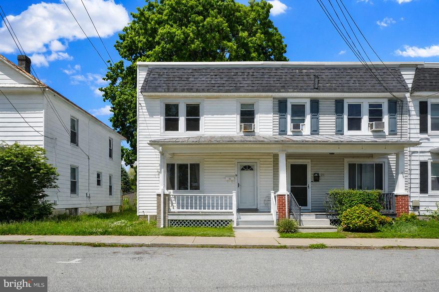 Welcome to this charming and spacious end of row townhouse located in the heart of Westminster! Offering 3 bedrooms, 1 full bath, and over 1,500 finished square feet, this move-in ready home blends classic character with comfortable living spaces and endless potential. Step onto the inviting covered front porch and into a bright interior featuring updated flooring throughout, a traditional floor plan with generously sized living and dining areas, abundant natural light, and neutral paint tones ready for your personal touch. The kitchen offers ample cabinet and countertop space and a separate pantry/storage area for added convenience.

Upstairs, you’ll find three spacious bedrooms including an oversized primary bedroom with ample closet space, along with an updated full bathroom. The partially finished walkout basement provides additional living space, storage, laundry area, and endless possibilities for a rec room, office, hobby space, or workout area.

Enjoy outdoor living in the fully fenced rear yard complete with a covered rear porch, mature shade tree, detached garage/storage building, and an additional shed offering even more storage space. Alley access provides added convenience and  for additional parking. Conveniently located close to shopping, restaurants, parks, schools, and commuter routes!