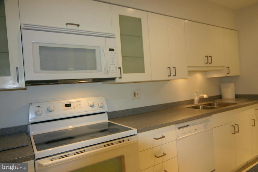 This 2 BR condo on the main entry level of the building (note there are 2 steps in front to get into the building) is ready for new tenants (the last tenant stayed approximately 9 years).  The kitchen has white IKEA cabinets, Corian countertops, and white appliances, including a built-in microwave, all installed in 2009.  Carpets have been professionally cleaned.  Vinyl tilt-in windows and a French balcony door were also newly installed in 2009. The living room and kitchen have recessed lights. Large walk-in closet in the primary bedroom*New stacked washer and ventless dryer installed 12/30/2025.  Rent includes gas heat & water, you pay only the electric.  There are two community pools, several tennis courts, tot-lots, and 2 party rooms (available to rent). There is one assigned parking space #621 plus additional parking available in any unnumbered space (no special tags required, but association says no commercial vehicles are permitted in the parking lot, and cars must have current tags/inspection stickers).  Nearby shopping options include Trader Joe's, ALDI, Giant, and Whole Foods.  Lots of dining options, including Panera, Chipotle, Ledo Pizza, Tacos and Tequila, and Mike's American Grill, to name a few.  Fort Belvoir is located approximately. 10-15 mins away*The Express Bus to the Pentagon runs through the community.  Cardinal Forest ES, Irving MS, and West Springfield HS are all within approximately a mile of the residence.    Sorry, Owners prefer no pets and no smoking in the condo or on the balcony by residents or their guests.  Good credit is a must.  The income required is approximately $80,000/yr.  Military applicants will be asked to provide BAH.