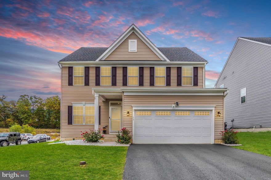 Welcome to this well-appointed colonial home boasting 5 bedrooms, 3 full baths, and 1 half bath, positioned elegantly on a charming corner lot. As you step through the inviting front door, you'll be greeted by the stunning Luxury Vinyl Plank (LVP) flooring that graces most of the main level. To your left, you'll find a conveniently situated main-level office adorned with glass French doors—a perfect space for productivity and focus. Moving through the hallway, prepare to be captivated by the expansive, open-concept floor plan. The kitchen is a chef's dream, showcasing granite countertops, upgraded stainless steel appliances, a ceramic tile backsplash, a substantial center island adorned with pendant lighting, and an abundance of cabinets to store all your culinary essentials. The kitchen seamlessly flows into the oversized family room, complete with a large ceiling fan—ideal for hosting gatherings and creating cherished family memories. Connected to the kitchen is a delightful dining room, conveniently located next to a sliding glass door leading to a picturesque stamped concrete patio in your rear yard—an outdoor haven for relaxation and entertaining. Also on the main level, you'll find a convenient half bath, a spacious pantry, and a coat closet leading to the oversized two-car garage, equipped with a 220V outlet, perfect for a welder, electric car, or other equipment needs. Venturing to the upper level, the luxury vinyl plank flooring continues on the stairs, hallway, laundry room, and hallway bath. The primary bedroom is a true retreat, featuring a sitting area, an expansive walk-in closet, and an ensuite luxury bathroom with dual vanity, water closet, and a magnificent roman shower with tile surround and bench seat. Additionally, this floor houses 3 generously sized bedrooms, a walk-in laundry room, and another well-appointed hallway bath. Descending to the lower level, the stunning vinyl plank flooring guides you to a spacious recreation room, the 5th bedroom, a 3rd full bath, and a generously sized storage room to accommodate all your family's needs. This property boasts not only elegance but practicality and functionality. Conveniently located near I-81 and I-70, doctors' offices, shopping centers, restaurants, and schools, this home is primed for the utmost in comfortable living. Don't wait; this opportunity won't last long. Schedule your showing today and make this exceptional property your cherished home!