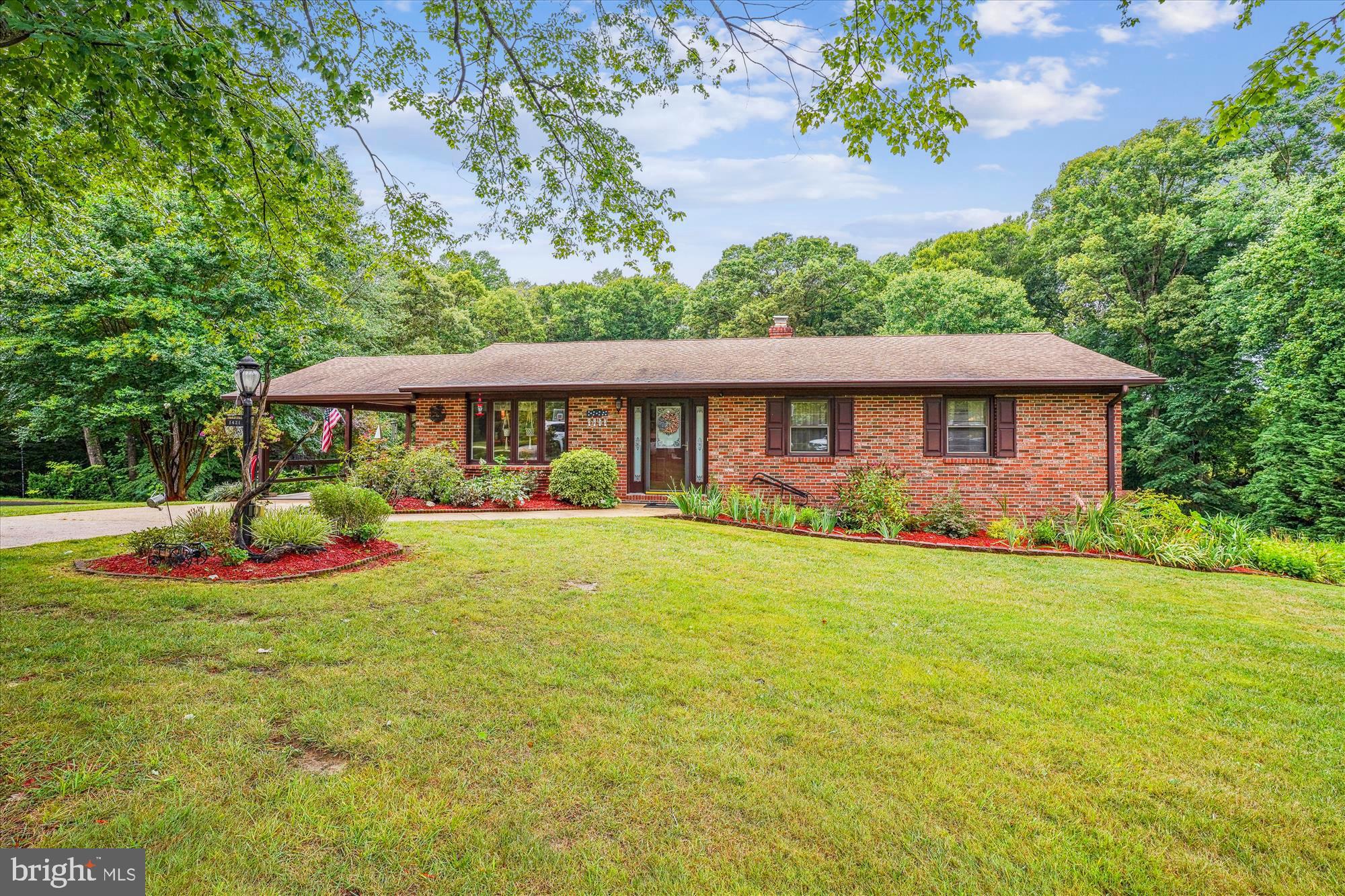 BEAUTIFUL RAMBLER on Fully Finished Basement Located in the Heart of Huntingtown!!! This Beautiful Home has been recently Updated & Shows Very Well *** The MAIN LEVEL Features Hardwood Flooring, Crown Molding * Entrance Foyer with Slate Flooring & Coat Closet * Gorgeous Kitchen with Upgraded Corian Countertop & Beautiful Maple Cabinets with underneath lighting, New Refrigerator & Dishwasher, Gas Oven, Microwave, Bay Window, Kitchen Table Space with a door to the Carport * Living Room * Small Dining Room with Built-in-Cabinets/Drawers & Door to Deck off the back of the house * Three Bedrooms which includes the Primary Bedroom with an Updated Primary Bathroom which has Corian Countertop, Ceramic Tile & Shower w/Shower Door * Updated Hall Bathroom with a Deep Soaking Tub, Ceramic Tile *** The LOWER LEVEL Features a Family Room with a Gas Fireplace, Built-in-Shelving & Door to Back Yard * Plus a Rec Room where you could have a pool table or gym area * 4th Bedroom * Full Bath * Spacious Laundry Room with a Washer & Dryer, Sink, Cabinets, Ceramic Flooring, & another Door to the Back Yard * Den or Office Space *** There is a Huge 4 Car Detached Garage (Car Lift Does Not Convey) which comes equipped with Electric, Cable hookup, Oil Heat & Running Hot Water * Large Run-In-Shed/Barn/as-is * Tall RV Carport * Situated on a Very Nice & Usable 1.11 Acre Lot * Roof was replaced in 2012, Septic 2020 & New Drilled Well in 2022 * Deck * No HOA!!! Currently in Huntingtown High School District * Not far from the Patuxent River where you can go fishing, crabbing & boating & also not far from the Chesapeake Bay where they have lots of Restaurants with Gaming, Boardwalk ** Other amenities in the area are Calvert Memorial Hospital, Shopping Centers, Flagship Theater, In-Door Swimming Pool, Kings Landing Park with outdoor Swimming Pool, Fishing Piers, Restaurants, Gyms, & more!