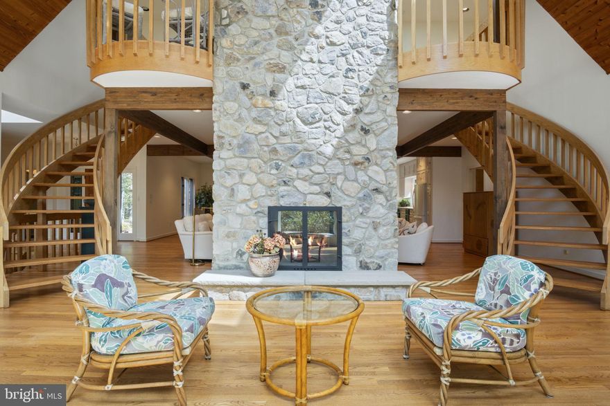 Nestled within the serene enclave of Laurelcrest, this exquisite chalet-style residence offers a blend of rustic charm and modern luxury. Set on an expansive 5.08-acre lot, the property is enveloped by lush trees and woods, creating a retreat like environment that feels worlds away from the hustle and bustle. As you step inside, you are greeted by an inviting open floor plan that seamlessly connects the living spaces. The heart of the home features a spacious family room, perfect for gatherings, adorned with a stunning double-sided wood fireplace that adds warmth and character. Skylights bathe the area in natural light, enhancing the inviting atmosphere. The gourmet kitchen is a culinary enthusiast's dream, boasting an island for casual dining, built-in cabinetry, including a single oven, dishwasher, and a convenient trash compactor. The main level also features a thoughtfully designed breakfast area, ideal for enjoying morning coffee while overlooking the picturesque surroundings. A walk-in shower in the rustic appointed bathrooms adds a touch of spa-like luxury, while the additional half bath ensures convenience for guests. Retreat to the upper level where four generously sized bedrooms await, each offering a peaceful sanctuary. The fully finished basement, with a rear entrance and walkout level, provides versatile space for recreation or relaxation, further enhancing the home's functionality. Outside, the property is complemented by charming exterior features, including exterior lighting options, a classic chimney, adding to its overall appeal. The side-entry attached garage provides ample parking and easy access. This residence is not just a home; it embodies an exclusive lifestyle, offering 24-hour security for peace of mind and the luxury of space to explore and enjoy nature. With additional parcels available, the possibilities for expansion or enhancement are endless. Experience the perfect blend of comfort, elegance, and natural beauty in this remarkable property, where every detail has been thoughtfully curated to create a warm and inviting atmosphere. Embrace the lifestyle you've always dreamed of in this stunning mountain retreat. This property could take on many forms: Home, family retreat, VROB, AirB&B