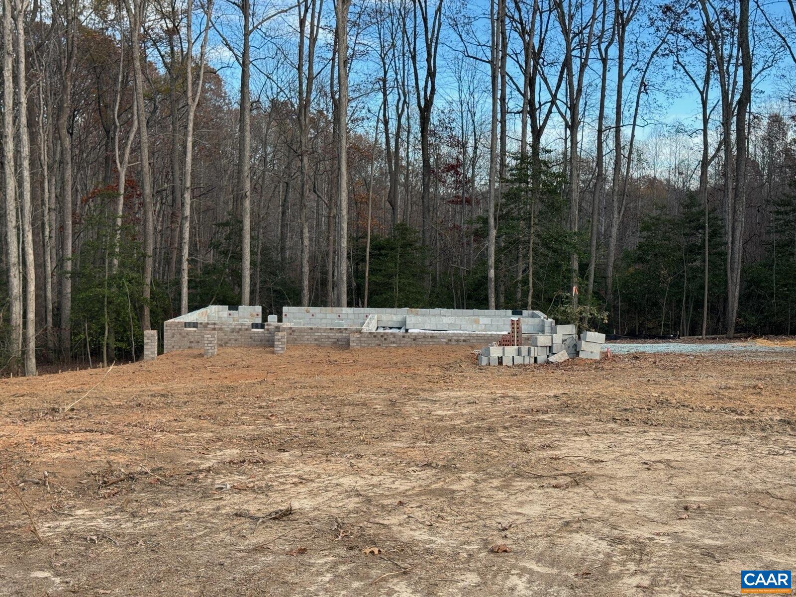 ROUGH INS UNDERWAY (1/14) The Brookwood model, sited on 4.7 acres, with plenty of upgrades throughout. Welcoming front porch, shake in three sections, craftsman style front door, wide window trim on front elevation, Black windows and gutters, 8" stained porch columns, side load garage and a 10x16 rear deck finish off the exterior upgrades. Interior upgrades include the New optional kitchen with large island, granite countertops, pantry, 42? Tier 2 cabinets, stainless steel appliances, and laminate floors throughout the entire first floor except the great room. Square edge trim package in dining room. Black hardware package throughout. The oak stairs with craftsman railings lead you to the second floor with spacious master suite with the vertical trim wall package, ceiling fan and sitting area, master ensuite with 5? shower with transom window and double bowl vanity. The three additional bedrooms include LED overhead lights. Pull down attic stairs for added storage. Ask how you can receive up to $12,500 in closing cost assistance. LATE SPRING COMPLETION! NO HOA, WATER OR SEWER FEES! PHOTOS are of a Similar Completed Brookwood,Granite Counter,Wood Cabinets