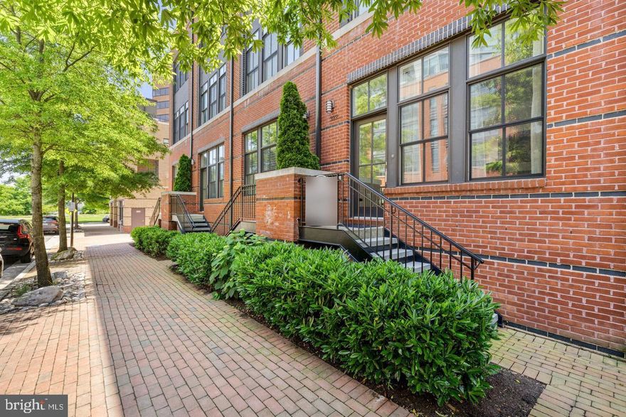 Luxury 3 bedroom, 3 bathroom townhouse in Printers Row, North Old Town, located 1/2 a block from the Mt Vernon river trail and just a 15-minute walk to all the fabulous restaurants and shops in Old Town. This stunning light-filled home, with soaring ceilings and light oak hardwood floors throughout, includes 2 assigned parking spaces in a secure underground garage accessible from the unit’s lower level, plus additional visitors parking and a secure bicycle storage room. The main level features a beautiful open floor plan with modern architectural flare. When you enter the living room, with its two-story high ceilings and wall of extra-large windows, you will notice a beautiful two-sided gas fireplace that is also enjoyed in the dining room and in the all-white gourmet kitchen with marble countertops that opens to a lovely private patio for morning and evening entertainment. The Primary Bedroom Suite occupies the entire upper level 1 with floor to ceiling windows, two large closets, and a spa-like bathroom with double vanity, large walk-in shower and a soaking tub. In addition, this fabulous primary bedroom opens to a large balcony overlooking a beautifully landscaped, quiet courtyard. Upper level 2 features light oak wooden floors, 2 spacious bedrooms with floor to ceiling windows, a hall bathroom and laundry with full size washer and dryer. The upper level 3 has a spacious, sunny family room or entertainment space that opens to two separate decks, one facing the front of the building and the other facing the quiet courtyard in back. The larger deck, with a view of the Potomac River and Washington DC, is glorious at night when all the city lights shine. The fully finished lower level with a full bathroom is perfect for an exercise room, office or for hosting more overnight guests. Updates include: 1) custom solar window shades on the main floor, Primary Suite and 3rd bedroom/office, 2) new drapes in the LR and 3rd bedroom/office, 3) designer ceiling fan in the Primary Suite, 4) new carpeting installed on top of the existing hardwood floors in Primary Suite, the staircases leading to the lower level and to the Primary Suite, and the lower level exercise/office area, and 5) brand new ADT alarm system with window sensors, remote key pad and motion detectors. Large wall mounted TV in the lower level work out area conveys. Location, location, location: quiet and convenient neighborhood, only two lights from DC and a 7 minute drive to DCA airport, within walking distance of Trader Joe’s and Harris Teeter plus lots of wonderful restaurants in Old Town such as Hanks Oyster Bar, TJ Stones, Oak Steakhouse, St. Elmo’s Coffee, Sisters Thai, Vaso’s Kitchen and the new Pupatella.