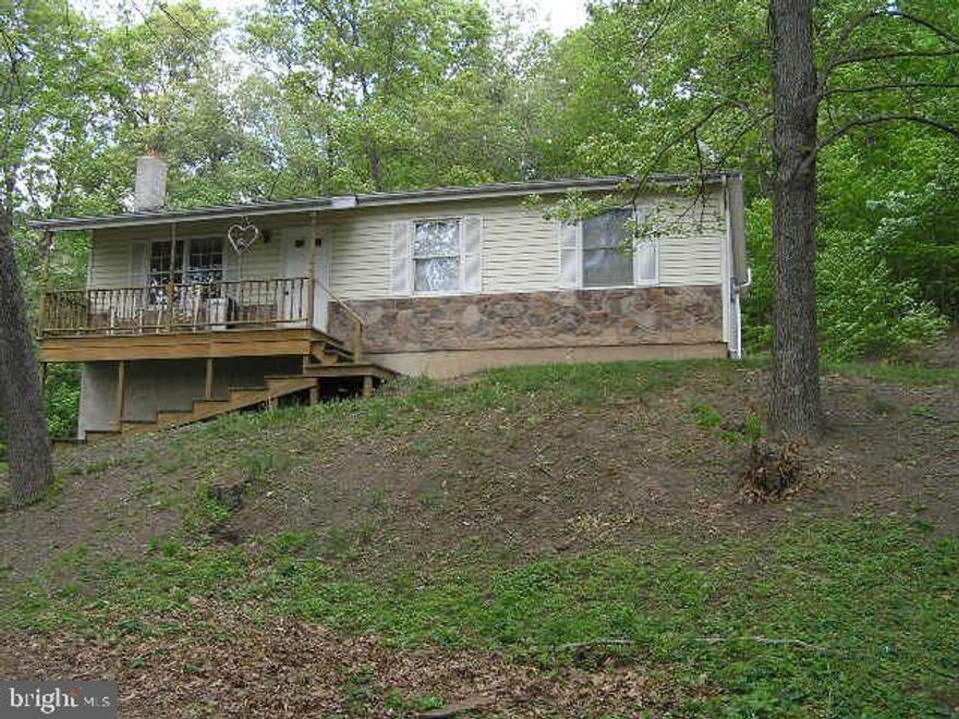 This 3-4 bedroom raised ranch sits on just over 2 acres and is located within 5 minutes of Route 322.  It has 3 bedrooms on the main floor, and 1 bedroom in the basement.  The basement also has 1 vent for heating and AC into a finished playroom area as well.  The property has been very well maintained and is the last house back Burd Lane, so it has nice privacy as well.  There is a covered front porch and a large rear deck for entertaining friends and family.  Call today to set up a showing. Agent is related to seller.