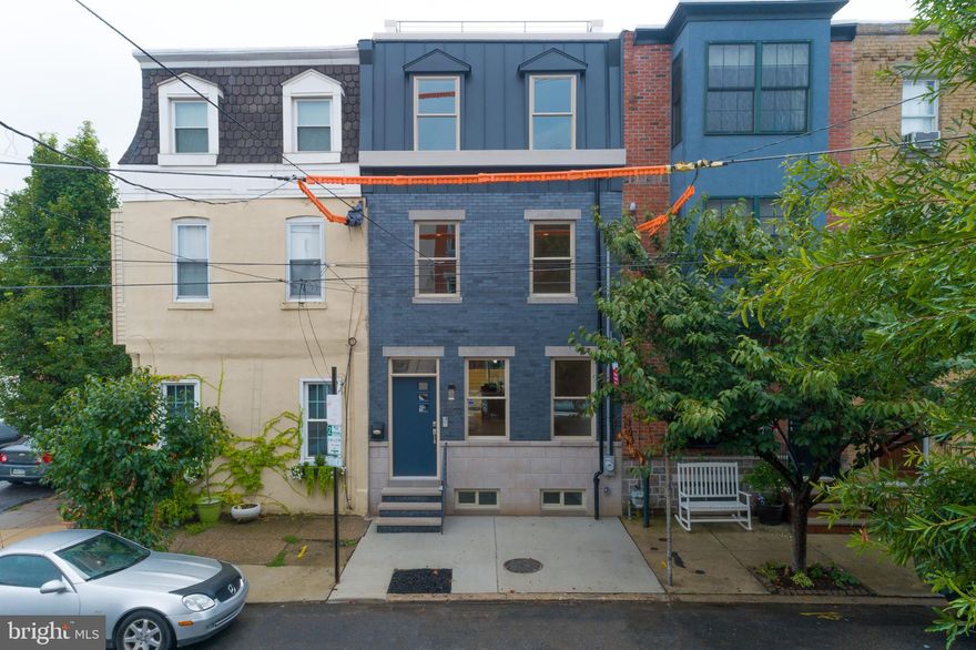 A completely renovated 3 story modern brick front row home in one of Philadelphia's most desirable neighborhoods. This home was recently renovated top to bottom.  Enter into an open floor plan with 9ft ceilings, living room, dining room and beautiful Kitchen with modern amenities.  42" white cabinets, quartz counter tops,  spacious island with breakfast bar, and backyard access to finish off the first floor. Custom metal railings lead to the completely finished basement which offers a large entertainment space with ample natural light, a half bathroom and utility room with a new HVAC system, new electrical system, and new plumbing. Head up the custom metal stairs to the  second floor which possess two large bedrooms, a full bathroom, laundry room, and a linen closet. Enter into the 3rd floor master suite and be greeted by 9ft ceilings, a large custom 12ft walk-in closet, and a grand master bathroom with custom floor-to-ceiling tile, stand alone tube, seamless glass doors, and double vanity.  Head up the stairs to the pilot house which includes a full custom wet bar that leads to the roof deck with unobstructed center city views. This home is located on a quiet block. Property is in close proximity to public transportation, restaurants, and night life. 10 year tax abatement approved. A must see.