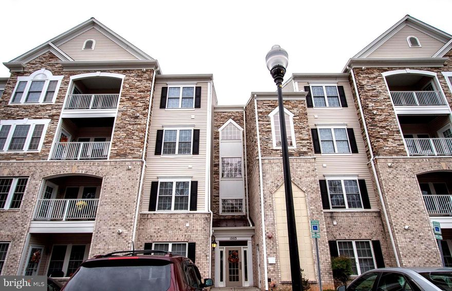 Exquisitely maintained and upgraded by builder....top floor unit looks out at wooded setting and walking trail.  Morning sun on deck with rolldown curtain.  9' ceilings show off 42" cabinets and upgraded appliances.  Breakfast nook .......Den off nook for TV or office space.  Crown Moulding added to Dining Room for elegant appeal.  Fireplace in Living Room....instant on for great ambiance and additional warmth.  Small quiet community close to shopping and restaurants....easy commute to Beltway or I95