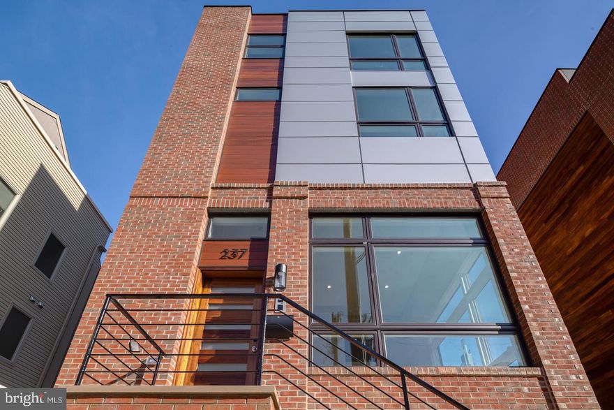 Stunning Corner Home with elevator, roof deck & two-car garage in Logan Square! Experience luxury living in this exceptional corner property, ideally located just above Rittenhouse Square in the desirable Logan Square neighborhood of Center City. Situated within the Albert M. Greenfield School catchment and just blocks from the Comcast Centers, this spacious home offers unmatched convenience and style. Enjoy breathtaking skyline views from the expansive roof deck, complete with a dry bar and refrigerator in the pilot house. A second outdoor deck is located just off the kitchen, providing additional space for relaxation and gatherings. Inside, natural light pours through oversized windows, illuminating the thoughtfully designed floor plan. Elegant, high-end finishes include wide plank hardwood floors, designer fixtures, and a chef’s kitchen featuring high end appliances, along with an oversized granite island. The two-story living room creates a dramatic focal point, while the private primary suite offers a luxurious retreat with walk-in closets and a spa-inspired bath featuring a floating tub, double vanity, and an expansive glass shower. Additional highlights include high-efficiency heating and cooling, a two-car garage, and the convenience of an in-home elevator. Walk to Rittenhouse Square, 30th Street Station, the Schuylkill River Trail, the Barnes Foundation, and more. This one-of-a-kind home offers the best of city living with top-tier amenities and unbeatable location. Taxes and square footage is the responsibility of the buyer to have verified independently.