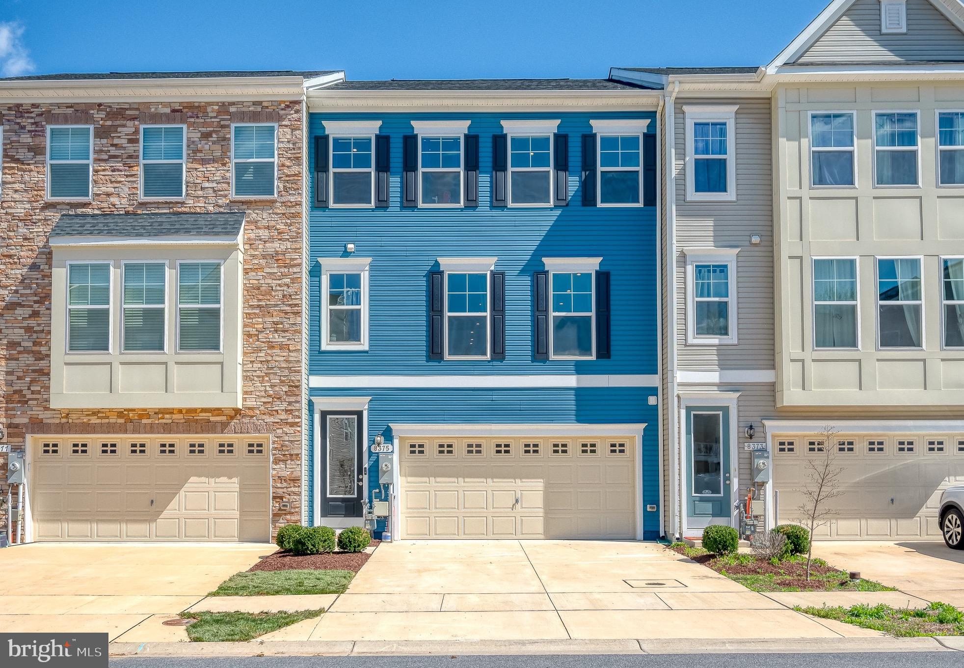 Stunning three-level modern townhome offering over 2,500 sq ft of thoughtfully designed living space, a two-car garage, and a modern, open-concept layout. Built in 2021, this home features a gourmet kitchen with quartz countertops, double wall ovens, gas cooking, a coffee bar nook, and extended cabinetry. The bright main level boasts luxury vinyl plank flooring, recessed lighting, and access to a full-width Trex deck with peaceful rear views. Upstairs, the expansive primary suite includes a large walk-in closet with custom shelving and a spa-like en-suite with dual vanities and a tiled walk-in shower. Two additional bedrooms, an upgraded hall bath, and a convenient laundry room complete the upper level. A rare main-level bedroom with a private bath and walk-in closet, plus a versatile mudroom entry, add flexibility and functionality. Enhanced electrical upgrades, wifi access in every room, upgraded lighting, EV charging outlet, smart wiring throughout, and custom closets elevate this home further. Community amenities include a playground, tot lot, dog park, and jogging paths. Ideally located near major routes, BWI, MARC/Amtrak, Fort Meade, shopping, dining, and parks. 10-year structural builder warranty conveys. Luxury, function, and location — don't miss it!