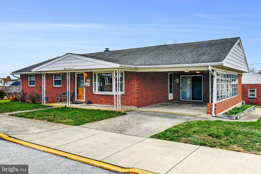 Charming Brick Rancher on a Double Lot in a Convenient West York Location!
Welcome home to this delightful 2-bedroom, 2.5-bath brick rancher offering exceptional indoor and outdoor living spaces. Ideally situated in a convenient West York location, this property sits on a generous double lot and features timeless curb appeal with a welcoming front porch and a convenient attached carport complete with a storage room.

Inside, you’ll find an inviting eat-in kitchen featuring beautiful oak cabinetry, stainless steel appliances, a double oven, and abundant storage. The kitchen opens to a large screened-in porch, perfect for relaxing or entertaining. The living room with its bright bay window fills the home with natural light. The primary bedroom includes a full ensuite bath and a walk-in closet.

The fully finished lower level expands your usable space with a powder room, summer kitchen, and a workshop, ideal for hobbies, guests, or extended living needs.

Major system updates include HVAC replaced in 2024 and hot water heater replaced in 2023, offering peace of mind for years to come.

Car enthusiasts, hobbyists, or those in need of extra storage will appreciate the huge detached brick two-car garage with workshop space. Outdoor living continues with a spacious Trex-style rear deck, perfect for gatherings, grilling, or quiet evenings.

This well-maintained home is ready for your personal updates, offering comfort, functionality, and an unbeatable location—truly a must-see!
