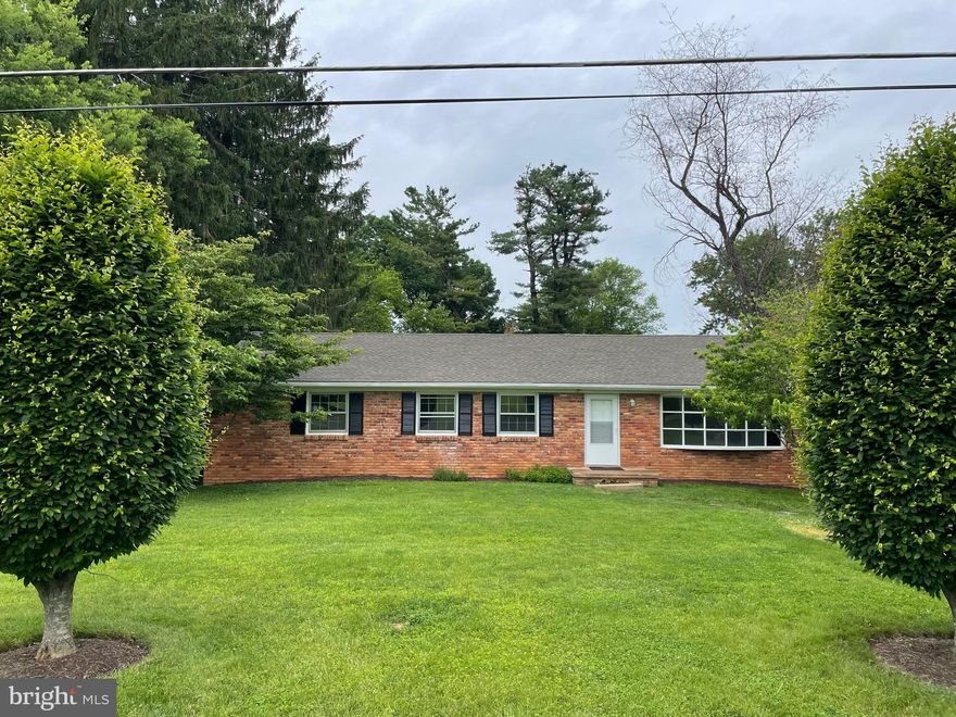 BUYER FINANCING FELL OUT- Your Gain! Back on the Market!!
This spacious, vintage brick rambler offers 4 bedrooms and 2 full baths on the main level,  HUGE finished basement with recreation room and wood burning FIREPLACE,  and 2 bedrooms, a full bath, kitchenette and laundry room. PLUS, a 1-bedroom APARTMENT with full bath, living room/kitchen on GROUND level in the rear of the 2-car garage! NEW flooring on both levels, freshly painted, NEW HVAC system installed, enclosed glass sunroom with built-in brick grill,  two laundry rooms (one in basement and the other is off the kitchen which could serve as an entry/mud room). Natural gas cooking and wood burning fireplace in the LIVING room with BAY WINDOW! Very attractive built-in bookcase and cabinets in the hallway, bedroom #3 and recreation room.  Private, flat backyard with mature trees, FAUQUIER HIGH SCHOOL district and all the charm and conveniences of Warrenton at your doorstep!