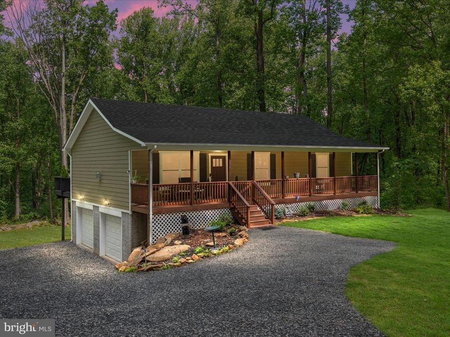 Welcome to 295 Rocky Mount Road in Linden, Virginia—a beautifully built mountain retreat nestled in the foothills of the Blue Ridge, offering peaceful seclusion and modern comforts. Completed in 2023, this 3-bedroom, 2-bath home sits on a spacious, tree-lined lot and features clean, contemporary finishes that complement its rustic surroundings.

Step inside to find a bright and airy living space with vaulted ceilings and large windows that frame the natural beauty outside. The open-concept kitchen is equipped with stainless steel appliances, quartz countertops, and an eat-in bar, making it perfect for everyday living or entertaining. The primary suite is a tranquil escape with a spacious layout, private bath, and a walk-in shower with sleek, modern finishes. Two additional bedrooms offer comfort and flexibility for guests, family, or a home office, and the second full bath is thoughtfully designed with contemporary touches.

Outside, the large deck invites you to relax, dine, or simply take in the wooded views. The expansive lot offers endless possibilities for outdoor living, from gardening and play to cozy evenings around a fire pit. A two-car garage adds convenience and ample storage for tools or recreational gear.

With all-new systems, energy-efficient construction, and a thoughtful blend of mountain style and modern ease, this home is ready for its next chapter. Located just minutes from local wineries, trails, and situated between quaint towns of Marshall and Front Royal, 295 Rocky Mount Road offers the perfect balance of retreat and accessibility.