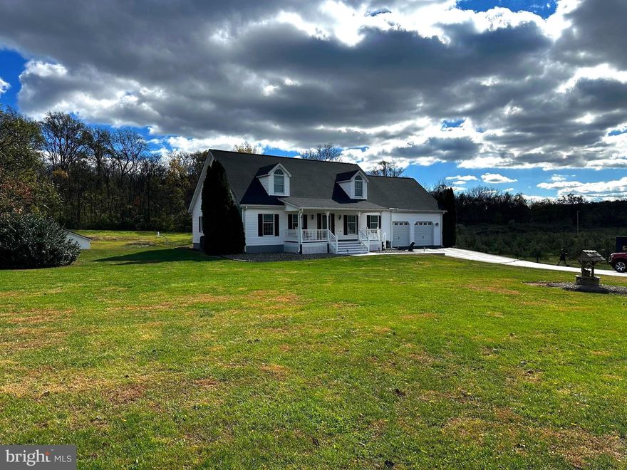 Nestled on a 2 acre rurual lot overlooking a small apple orchard, this stunning Cape Cod-style residence offers an exceptional blend of comfort, style and modern convenience. This meticulously maintained home boasts 4 spacious bedrooms and 3.5 bathrooms, providing ample space for relaxation and entertainment. Step inside to discover a thoughtfully designed interior that exudes a warm relaxing atmosphere. The traditional floor plan features luxury vinyl plank and engineered wood flooring, creating a seamless flow throughout the main living areas. The main level family room (opening to the separate pool table/game room) provides the perfect atmosphere to just kick back and relax at the end of the day. The inviting kitchen is equipped with new granite countertops, cherry cabitnetry and stainless steel appliances. Enjoy casual meals in the cozy breakfast area or host formal dinners in the separate dining room, perfect for creating lasting memories with loved ones. The spacious second floor master suite (including the large walk in closet) features a jetted tub and walk-in shower, ensuring a private retreat at the end of the day. While the convenienty located FIRST FLOOR  GUEST SUITE offers a large soaking tub and separate shower. The basement recreation room with fireplace and bar provides the ideal setting for hosting your next Super Bowl party. This expansive 4,624 sq. ft. layout includes the mostly finished basement with a rear entrance and walkout stairs, offering endless possibilities for customization. Whether you envision a home gym, media room, or additional living space, this area is ready to accommodate your needs. Situated on a generous 2-acre lot in a rural setting, this property provides a peaceful escape from the hustle and bustle of city life. The exterior features durable vinyl siding and a charming façade, complemented by double-hung and sliding windows that invite natural light while offering picturesque views of the surrounding rural landscape. . In addition to the attached two car garage (with fixed stairs to additinal overhead storage space) the car enthusist is going to love the detached 3 car garage with it's own heating / air condtioning system.  Come and experience the tranquility of rural living (WITH NO HOA), while still being conveniently located near essential amenities. This home is not just a place to live; it’s a lifestyle choice that offers the perfect balance of comfort, style, and functionality. Don’t miss the opportunity to make this wonderful property your own—envision the possibilities that await! SEE THE COMPLETE FEATURES LIST INCLUDING; NEW ARCHITECURAL SHINGLES ON THE HOME IN 2023 / A NEW METAL ROOF ON THE DETACHED 3 CAR GARAGE IN 2022 / NEW LVP FLOORING, ETC.