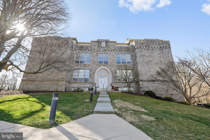 Unique opportunity high on the hill in the heart of the Ellicott City Historic District. Your Penthouse Dream Space. Embrace the Tony Lifestyle in 'The Schoolhouse'. Originally built as Rock Hill College, then later The Ellicott City School, this exclusive location boasts high ceilings, unparalleled views, and an expansive private balcony. Sun-bathed by custom-made 8-foot tall, high efficiency slider doors the unit enjoys amazing vistas that change with every season. The ambiance of the unit is further enhanced with cathedral ceilings throughout. This is a decorator's dream as each room presents a unique opportunity to express your style with credibility. The HUGE Private Balcony offers the most exclusive view in all of the Historic District. The kitchen offers an ideal workspace for even the most discerning chef. Make a statement. The GRAND entrance will have your guests enthralled and ensure a satisfied smile each time you enter your new home. Find privacy in the heart of the Ellicott City Historic District. It's a short walk from the lovely grounds high on the hill to your favorite restaurants and shops, become a part of something larger! Two parking spaces are guaranteed with the unit. Bonus storage space in the communal basement! The HVAC unit, balcony doors, and most windows were recently replaced. Located in a highly rated school district. This unit is an absolute GEM. EXCLUSIVE, POSH, TONY, PRIVATE, QUIET, UNIQUE, these words only begin to describe this unit. Must be experienced to be believed. Owners are related to the listing agents.  FOLLOW COVID-19 PROTOCOLS PRIOR TO ENTERING BUILDING AND WHILE ON TOUR.