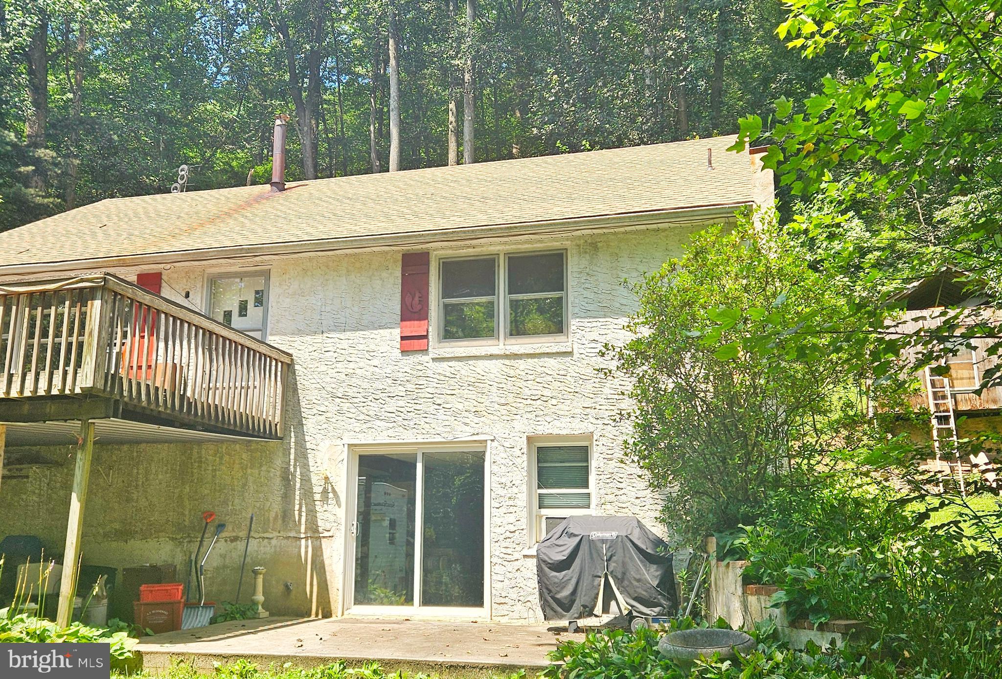 Take a look at a Hunters and fisherman's paradise. This home is located on a trout stream along the front and adjoins State Game lands. As you cross the stream, there is a lovely large parking area, The wrap around deck welcomes plenty of light and a view of the stream. The home features 4 Bedrooms, a full bath , Large rooms, updated Kitchen and Family room addition. On the lower level, there is an in-law suite with separate access at ground level. Plenty of storage, This home sits on a country road surrounded by woods, but still near the conveniences of town.