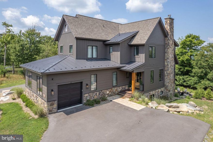 Stunning Mountaintop Ski-In/Ski-Out Luxury Home in the Ridge Run Community on
Wisp Mountain.
Experience the pinnacle of mountain living in this extraordinary, professionally designed
and decorated home with approximately 5,500 finished sqft, where every detail is crafted to delight. The gourmet kitchen is a
culinary dream, featuring high-end appliances, marble countertops, and ample
workspace-perfect for both everyday meals and memorable gatherings. Entertainment
abounds with a private indoor basketball court, a luxurious hot tub for relaxation, and
multiple fireplaces-wood burning and gas-for cozy evenings. Challenge friends and
family to a game of pool or gather in the private movie theater for a cinematic
experience. Step outside to enjoy the fresh mountain air while roasting s’mores over the
outdoor fire pit, sharing stories that will become treasured memories. Whether savoring
a cup of hot cocoa by the fire or exploring all that Deep Creek Lake has to offer, this
home promises a luxurious retreat like no other. Indulge in a residence that redefines
elegance and comfort-a place where every moment is an experience and every stay is
unforgettable.
Discover luxury living at its finest in this stunning, three-level home featuring an open
floor plan, top-of-the-line finishes, and an abundance of natural light that seamlessly
connects indoor and outdoor living. Nestled atop Wisp Mountain in the highly soughtafter
Ridge Run Community, this residence offers unparalleled convenience-just steps
from Chairlift #7, granting you effortless ski-in/ski-out access. Despite its serene
mountaintop setting, the home is only minutes from Deep Creek Lake, ensuring you’re
close to boating, whitewater rafting, dining, and year-round recreation. Every corner of
this immaculate home is thoughtfully designed, with designer furnishings and tasteful
decor creating an atmosphere of refined elegance throughout. The views here are
simply breathtaking, no matter the season. Residents also enjoy access to the
Community Aquatic Recreation Center (CARC), a state-of-the-art fitness and wellness
complex featuring a modern gym and a full-size indoor pool-perfect for staying active
year-round. Don’t miss the opportunity to own this exceptional property where every
detail reflects quality, comfort, and timeless mountain charm.
Being Sold Turnkey with Top-of-the-Line accoutrements $10,000 Custom Kitchen Range, Hand-Built in Italy 
Solid Brass Interior Door Handles and  Bathroom/Kitchen Fixtures 
Over $200K in Rental Income in 18 months  All Solid Wood Handmade Custom Vanities with Solid Marble/Stone Tops  Solid Wood Handmade Custom Entryway Locker System ,Solid Wood Handmade Built in Bunkbeds with Solid Brass Accents ,2 Full Size Sets of Washer/Dryer ,2 Dishwashers ,Custom Build Appliance Garage in Kitchen, All High-End Custom Lighting including Restoration Hardware, Visual Comfort, Curry & Co. $15K Special Order Restoration Hardware , Dining Table Custom Tilework Throughout all Bathrooms including, Cle Special Order Zellige Tile, $22K Custom Kravet Sectional Sofa, In Home Movie Theater with Power Recliner Chairs, In Home Half Basketball Court with Custom Wall Mural, Solid Wood White Oak Floors Throughout.