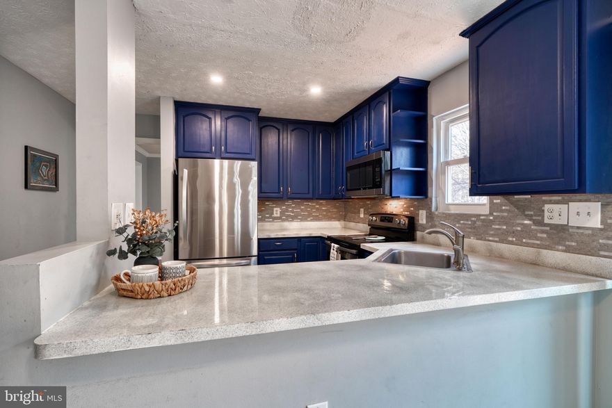 Welcome home to 13411 Steeplechase Drive. This home has been splendidly taken care of with updates and modernizing throughout. This home is ready to entertain with an open kitchen and living room with a wood fireplace. Off the living room through the sliding doors is a large deck that takes you down to a large fenced yard. Plenty of space for playing sports or letting the dog run around. Off the kitchen is a separate dining room and sitting room at the front. Upstairs are four bedrooms. The primary bedroom to the right fits a king sized bed. It features a walk-in closet and en-suite with new dual sink marble top vanity and lovely custom tile. Three more bedrooms are down the hall, plus a full sized bathroom with custom vanity and raised sinks. At the end of the hall is a very spacious closet. The basement is completely finished with a bar, laundry and an extra room that could be used as a gym or more storage. Turn this space into a true hangout. The two car garage allows entry into the home. A coat closet is conveniently located as you walk into the foyer, as well as a powder room.  All new double paned windows installed, including the sliding door with argon gas for added insulation 2 years ago. Windows have a transferable warranty. New stainless steel kitchen appliance and laundry units May 2021. New luxury vinyl flooring. This location is nearby to shopping, grocery, and many restaurants. Close to I-295 and route 50. Priced to sell! You are so close to everything, yet you'll feel so cozy while you're home. Make this house the home of your dreams.