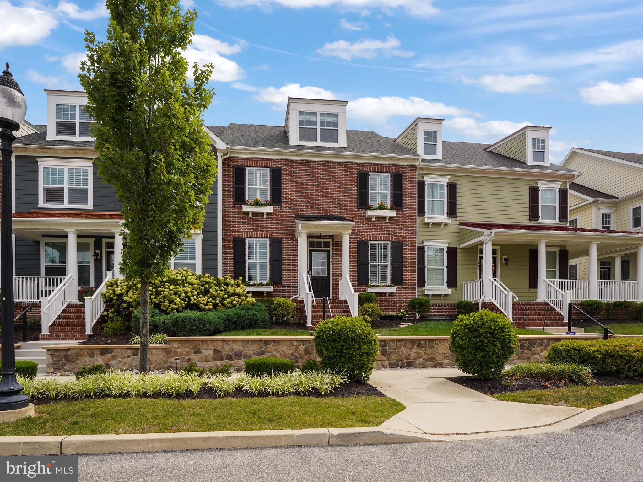 This brick-front townhome offers 4 bedrooms, 3 full baths, 1 half bath, and a detached two-car garage in the Spring Oak neighborhood in Great Valley School District! Enter into this beautiful, open-floorplan townhouse with wood floors throughout the first floor! There is a large home office, dining room/living area combination perfect for entertaining guests or family dinners.  The Kitchen has Century cabinets, a gas stovetop, a wall oven with a warming drawer and built-in microwave above, Granite countertops, stainless steel appliances, a pantry, and a large island. The upstairs offers a spacious Owner's Suite with two walk-in closets and an attached bathroom with a large Granite countertop with double sinks and a large tiled frameless-glass shower with corner shelves and a separate water closet with a toilet. Two additional bedrooms a full hall bath and a Laundry Room complete the upstairs. There is a 3rd Floor that not many townhouses in the neighborhood have with a fourth Bedroom and full bath. This floor has the potential for so many different uses. The basement is unfinished but has a rough-in for a bathroom. Off the kitchen, there is an expansive outdoor patio which is perfect for entertaining. This townhouse is right across from the Spring Oak Community Clubhouse with a banquet area, a resort-style pool, fitness area, an outside deck, and an outside patio picnic area with picnic tables and grills. There is also a bocce court. There are lots of walking/biking trails throughout the neighborhood and playgrounds. Located conveniently to the PA Turnpike, the Paoli Train Station, and close to many stores and restaurants.