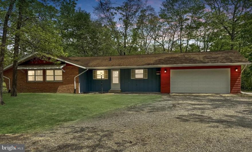 Welcome to 201 Hardwood Lane — a beautifully maintained 2,800 sq ft rambler with finished basement, perfectly situated on over half an acre in a peaceful, established neighborhood. With timeless mid-century modern flair and thoughtful updates throughout, this home is move-in ready and brimming with potential for your personal touch.

Freshly painted, this spacious 3-bedroom (with room for a 4th!) home features newly installed carpet, beautifully refinished hardwood floors, and a warm, inviting atmosphere. The main level flows effortlessly, offering bright living spaces and vintage details that lend character and charm.

All bedrooms are generously sized, with plenty of natural light and storage. The primary suite is spacious, complete with a private en-suite bath and a walk-in closet—offering comfort and convenience all on one level.

The kitchen and bathrooms, while dated, are clean, functional, and full of personality — ideal for those who appreciate retro touches or want to create a custom design over time. The large finished basement is a true highlight, featuring a cozy wood-burning fireplace, wet bar, laundry area, half bath, and walk-out access to the private backyard and patio — perfect for entertaining, relaxing, or expanding the living space with a fourth bedroom or home office.

Additional features include a 2-car garage, a 35-year architectural roof (less than 10 years old), and a large, tree-lined lot offering privacy and room to grow. Whether you're looking to move in and enjoy right away or dreaming of your next renovation project, this home offers a solid foundation, timeless style, and endless possibilities.

Don’t miss your chance to own a classic gem with space, style, and so much potential in Fredericksburg!