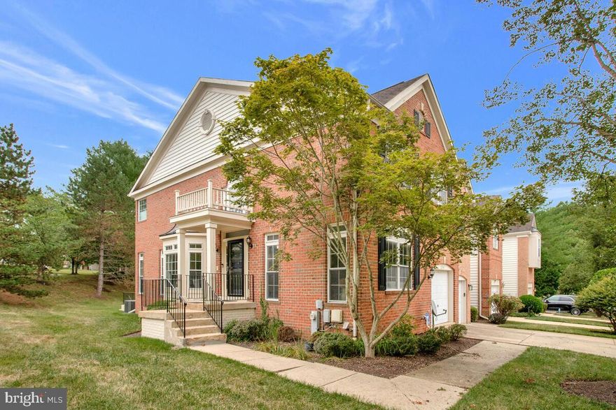 Clean, Spacious, and Move In Ready! Welcome to your dream home in one of the most sought-after neighborhoods in Prince George’s County! Nestled in the beautiful, tranquil, walkable, and tree-lined community of Woodmore South, this end unit brick front townhome offers modern amenities, spacious living, and an abundance of natural light.

As you step into the welcoming 2-story foyer, you'll immediately notice the wood floors that extend throughout the home. To the right of the entryway is a comfortable living room, perfect for entertaining or relaxing.  A conveniently located half bath is near the entryway for guests' ease. The elegant dining room provides an excellent space for meals and gatherings, while the great room retreat is ideal for spending quality time. The island styled wet bar enhances the entertainment options, and the kitchen, which overlooks the bar and the great room, features modern appliances and ample counter space.

The upper level boasts a large primary suite with vaulted ceilings, room for a sitting area, and an Ensuite  bath complete with a Jacuzzi tub, separate stand-up shower, and a private water closet. Two additional  bedrooms share access to a hall bath, conveniently located at the top of the stairs.

The finished basement offers versatility with a multi-purpose room that can be used as a bedroom or office. There's also plenty of space for exercise equipment or a game and TV lounge. A dedicated storage area also houses the washer and dryer, ensuring you have all the storage space you need.

Additional features include an attached garage with entry below the stairs near the main level half bath, providing convenience and security. The home's abundant natural light, spacious layout, wainscotting and modern wood floors throughout create a bright and welcoming atmosphere.

This townhome blends a contemporary flow with a peaceful, serene environment. Don’t miss out on the opportunity to make this beautiful home yours!