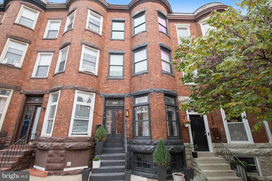 Welcome Home! 3-bedroom, 2.5 bathroom brownstone row home in the historic and vibrant Reservoir Hill neighborhood of Baltimore, MD. This meticulously maintained home offers a perfect blend of historic charm and modern convenience.  Property bragging points: Two Car parking pad, double deck including a rooftop deck, original hardwood floors, high ceilings, large windows that flood the home with natural light. The spacious kitchen has stainless steel appliances, ample cabinet space, and marble countertops. Upstairs, you'll find three generously sized bedrooms, each offering comfort and privacy. The primary suite features an en-suite bathroom, creating a peaceful retreat at the end of the day. Additionally, the home offers the convenience of a dedicated laundry room and a bonus room that can be utilized as a home office or additional living space. Located in Reservoir Hill, that is walking distance from the new "Reservoir Square" project featuring new shopping center. Also walking distance from Druid Hill park which will be completely renovated by 2024. Don't miss the opportunity to make this stunning brownstone row home your next residence. Contact us today to schedule a private showing!