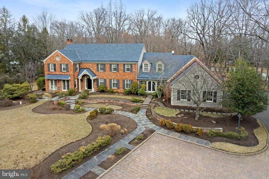 Timeless, elegant and tastefully done just begins to describe this exquisite custom built home in the heart of Gwynedd Valley. Drive down the long private driveway and discover the striking architecture of the classic colonial design crafted with superior materials  that sits on a private 1.88 acre lot boasting professional landscaping and extensive hardscaping.  This stunning home offers a harmonious blend of classic charm and modern luxury, with bright natural light flooding every room. Step into the expansive two-story foyer, which sets the tone for this beautiful home. Adjacent to the foyer, the study features built-in bookcases and French doors that open to a serene outdoor terrace, perfect for quiet reflection or entertaining. The formal dining room is a masterpiece of design with built-in corner cabinets, wainscoting, and a decorative medallion for the crystal chandelier, providing the ideal setting for memorable gatherings. The delightful sunroom, accessible via a side entrance, features a back staircase and connects to the attached garage and front yard's paver walkway. Enter into the chef's gourmet kitchen is a culinary enthusiast's paradise, boasting granite countertops, a large island with a vegetable sink, a new dishwasher, tiled backsplash, Sub-Zero refrigerator, walk-in pantry, and sliders to the backyard patio. Next to the kitchen, the family room invites relaxation with skylights, a brick-surround fireplace, and a built-in wet bar along with sliding glass doors leading to the rear patio.  Double doors lead to the living room, complete with a fireplace, abundant windows, custom molding, and the French doors guide you back to the study. Rounding out the main floor, there is a powder room, a laundry room and a  mud room that provides access to the three car garage. Upstairs, the primary suite is a luxurious retreat, featuring a vaulted ceiling, plush carpet, a dressing area, spa-like bath, and a custom-fitted walk-in closet. 4 other bedrooms are of adequate size and two share a Jack and Jill Bath and there is also a renovated full bath and unfinished attic space. The finished basement offers ample storage, a soundproof music room, a large recreation area along with a half bath. With plantation shutters on all windows and hardwood floors on the main level, this home is as functional as it is beautiful. A huge plus is the full house Generac gas generator. Enjoy the outdoors on the flagstone patio, surrounded by meticulously landscaped grounds. This residence is truly a sanctuary of elegance and comfort.