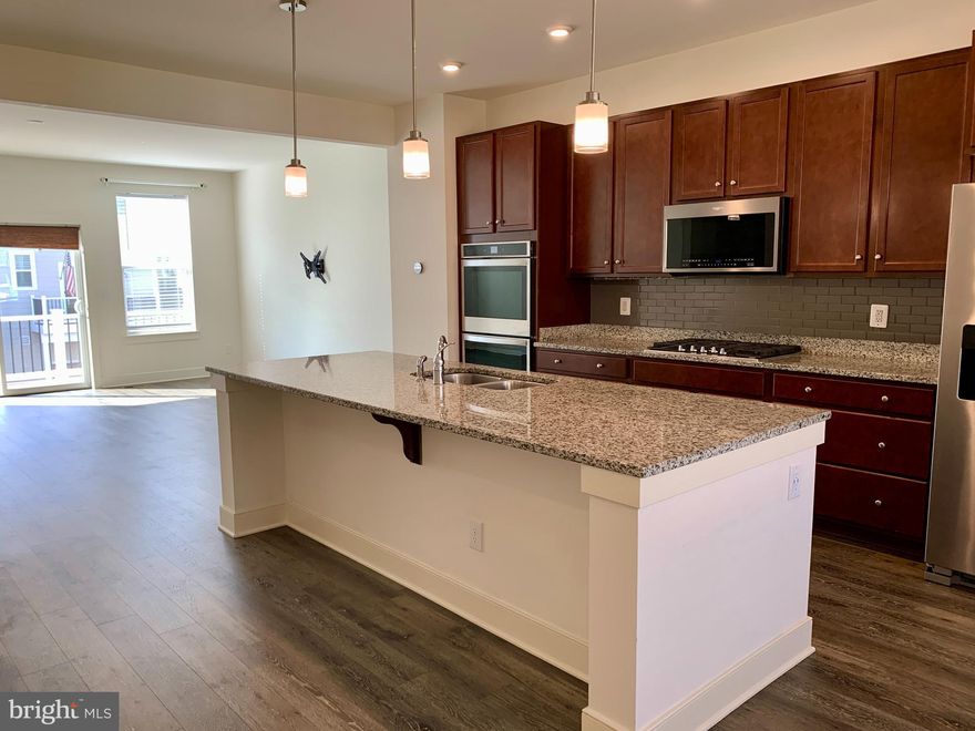 5 YEAR OLD BEAZER POTOMAC HOME SHOWS LIKE A MODEL WITH ALL THE UPGRADES! 
You will fall in love with this amazing 3 bedroom, 2 full bath , 2 half bath, 2 car garage home in the highly sought after 18 Hole Golf Course Community of Potomac Shores! 
Upgraded vinyl hardwood floors, upgraded stairs, luxury gourmet kitchen is a chef's dream come true with the stainless steel appliances, cooktop, oversize granite island, backsplash, double ovens and more! Open family room off the kitchen is great for entertaining and enjoy amazing view from the balcony! 

This neighborhood HOA offers many amenities including Ali Krieger Sports Complex, Canoe club, Fitness Barn including state of the art gym, clubhouse, demonstration kitchen, community garden, working greenhouse, movement studio, yoga lawn, tot lots, tennis courts, basketball courts, eight lane competition pool, family pool with sundeck and cabanas. FREE VERIZON INTERNET 150/150 Mpbs base speed INCLUDED IN THE HOA FEE.

The VRE is coming!! Community pool, close to shopping, community and easy access to 95, Stonebridge Town Center, and Potomac Mills, close to Quantico, Fort Belvoir, easy commuting to The Pentagon, The White House and Capital Hill!