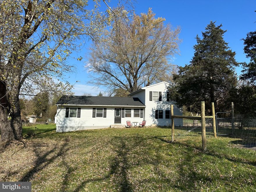 Welcome home!  This is the one you have been waiting for.  Major rehab in 2021!  This home underwent a transformation from a 4 bed 1.5 bath to a 3 bed 2 bath including a primary en suite and a tremendous amount of closet space.  

Upon entering the front door you are in the living room/dining combo with newly refinished original hardwoods.  Off to the side is an office space with glass French doors for quiet working times.  The kitchen is well equipped with a 5 burner gas stove great for those "home chefs"!  All the stainless appliances are new as of 2021.  In the family room, right off the kitchen, there is a wood-burning stove for getting truly cozy on those cold nights.  There is a sunroom/mud room adjacent to the kitchen and a laundry center around the corner.  There are 2 nice sized bedrooms and a hall bath that round out the main floor. 
 
Up the steps, you will find the entire upper level is dedicated to a primary en suite complete with a jetted tub, separate tiled shower, and ample closet space.  

The entirety of this home has been freshly painted, and the carpets have been professionally cleaned.

Sitting on a smidge over an acre this property is level, green, and has several large mature trees.  Sit out back on the deck and enjoy the wildlife and quiet that the country has to offer.  Or sit out front on the patio and enjoy the serenity of the area.  There is minimal landscaping to allow for your own style and color. 

Out back is a brand new 16x12 shed with a loft sitting on a gravel pad.  Permits were pulled for this large shed to be placed on the property.  Perfect for storage of gardening items, lawn tractors, kayaks, and so forth.  

Less than a half-mile walk down the quiet street is the Opequon Creek where you can fish, sit, launch a kayak, or just enjoy the sounds of the water.  

The entire property is fenced with wire livestock-type fence to keep critters in (or out)!

This is THE ONE!!