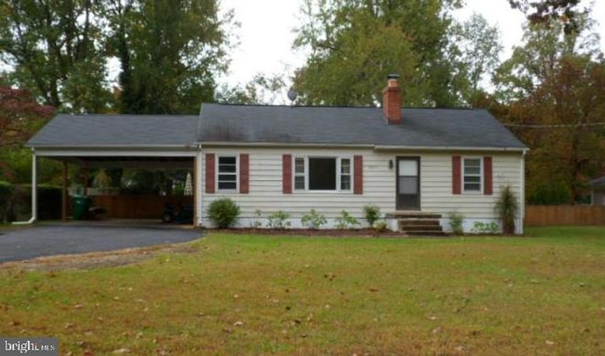 Nice location in the desirable Town Creek neighborhood, just minutes from Patuxent River Naval Base and nearby shopping. This 3-bedroom, 1-bath home features hardwood floors, a spacious kitchen, a fireplace, additional space suitable for a home office or flex room, an attached carport, and a huge, fully fenced rear yard—offering plenty of potential inside and out. The expansive backyard is ideal for entertaining, pets, or play. A fantastic opportunity for buyers looking to add their own updates and make it their own.