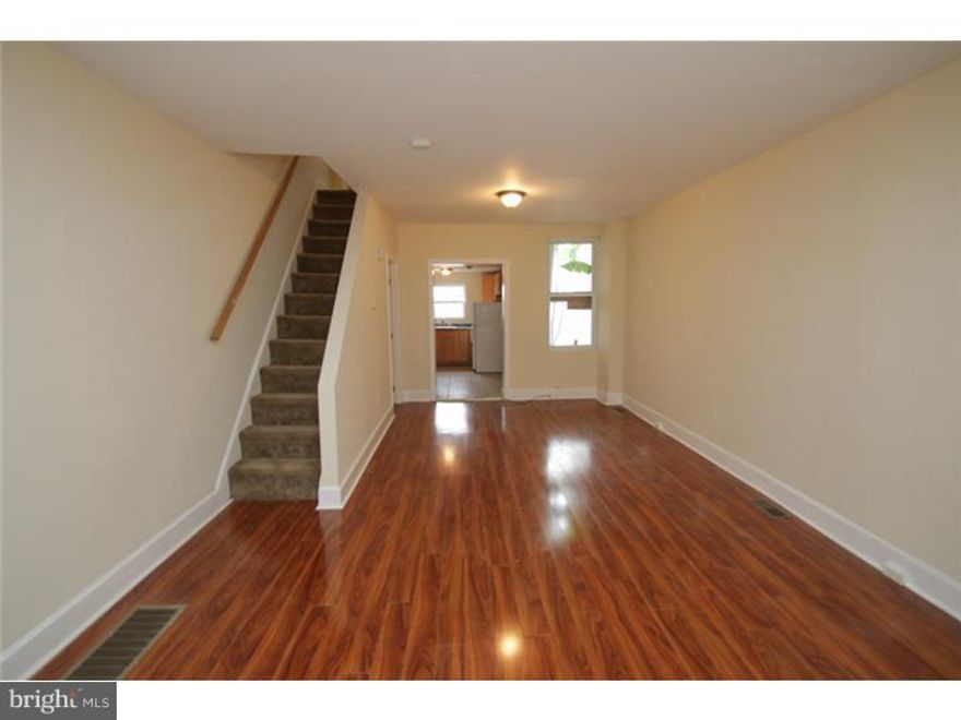 Gorgeous South Philly Row Home conveniently located and ready for move in! this home has undergone a complete makeover and features beautiful wood floors, an oak kitchen with luxury tile and beautiful appliances! Upstairs features a 3 piece bath and 2 nice sized rooms.  The property is perfect for a first time home owner and move in ready!
