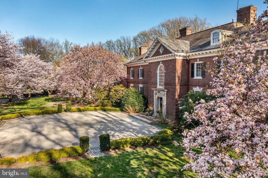 Experience the epitome of sophisticated living at 110 Woods Lane, where classic elegance and modern comforts intertwine seamlessly.  This iconic home, crafted in 1904 by the esteemed architect Horace Trumbauer, embodies timeless elegance with a touch of modernity.

When you drive into the elegant front parking courtyard you will find yourself at the grand wrought iron door.  As you enter this home you will find yourself in an extraordinary marble foyer, setting the tone for the home's luxurious ambiance. While the residence boasts grandeur, its floor plan offers wonderful expansive flow for family living, casual and grand entertaining. You will see exquisite details that are impossible to replicate today everywhere you look.   
The majestic two-story entrance features a sweeping staircase reminiscent of the opulent gilded age, leading to the second floor. Flanking the entrance hall are the living room, dining room, and paneled library . The living room, adorned with a marble fireplace, offers an elegant retreat, while the library, featuring inlaid wood floors and custom wood paneling, provides a sophisticated space with pocket doors to ensure uninterrupted time for work or to enjoy a good book. A beautiful loggia encircles this side of the home and provides gorgeous outdoor space with an indoor feel. There is a full bath and changing area conveniently located steps from the pool.

The gracious dining room is perfect for hosting family gatherings or formal dinners. Daily life revolves around the well-appointed kitchen, complete with a butler's pantry, breakfast room, and adjacent family room, offering ample space for relaxation and culinary creativity. Additionally, the first floor boasts a mudroom, laundry room, two powder rooms, and a versatile study, or music room. 

Ascending to the second floor, you'll find a spacious master bedroom with a sitting area, his and hers walk-in closets, and a luxurious master bath. Four large en-suite bedrooms and numerous closets provide plenty of accommodation and storage options. The beautifully finished third floor offers additional living space or bedrooms for family or guests, perfect for play, crafts, or accommodating an au pair, complete with a full bath.

Descending to the custom finished lower level, you'll discover a well-equipped workout area, media viewing space, powder room, wine closet, and expansive storage.

Outdoor amenities include an inviting in-ground pool, tranquil koi pond, a thriving vegetable garden as well as large open fenced  lawns. The  second driveway provides ample parking and leads to the garages. Enjoy the convenience of a whole-house generator.

Located in the heart of the Main Line and in one the most convenient locations. Easy access to Philadelphia, King of Prussia , major highways, transportation, the Village of Wayne and the award winning Radnor schools.