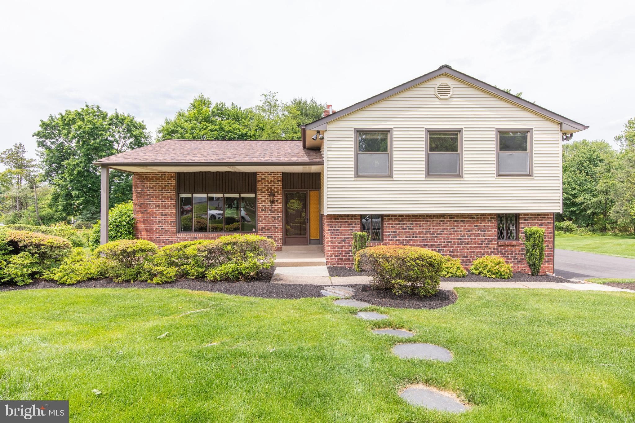 Look not further!  Expanded split level home situated on beautifully landscaped 1/2 acre level lot.  With almost 3300 Square Feet of living space you'll have the wonderful opportunity to live in sought after Upper Dublin Township and in its Award Winning School District with its state of the art high school.  Be prepared to fall in love with this timeless quality crafted 4 bedroom when you enter this charming, lovingly maintained home.  Appreciate the dramatic sunken Living Room graced with a volume ceiling and hardwood floors, decorative fireplace and bay window that floods the room with natural light and perfect for quiet nights and special occasions. The beautifully proportioned adjacent formal Dining Room with chair rail also features exposed hardwood floors and will allow you to entertain in uncrowded comfort. The Dining Room, which overlooks the gorgeous open rear yard and patio, flows directly into the recently updated eat in Kitchen boasting stainless steel appliances, granite counters, tiled backsplash, bay window, 5 burner gas cooking, built-in microwave, pantry, pocket doors to foyer and a door to the rear patio.  Step down to the entertainment sized Family Room featuring stoned wood burning fireplace and raised hearth.   On this level you will also find 2 well sized bonus rooms suitable for Exercise room, Playroom or Office providing sliding doors to the rear patio.  Tucked away is also the 2nd bonus room for Office or Den with convenient access out to the driveway.  The  Laundry and powder room are also on this level.  Move upstairs to the inviting Master Suite providing 2 walk-in closets and remodeled en-suite marble bath featuring double vanities and stall shower.  There are three amply sized additional bedrooms, a large walk-in storage closet and hall bath completing the second floor.  Close proximity to major arteries, shopping,  restaurants, LifeTime Fitness, Wegman's, Trader Joe's and the historic town of Ambler