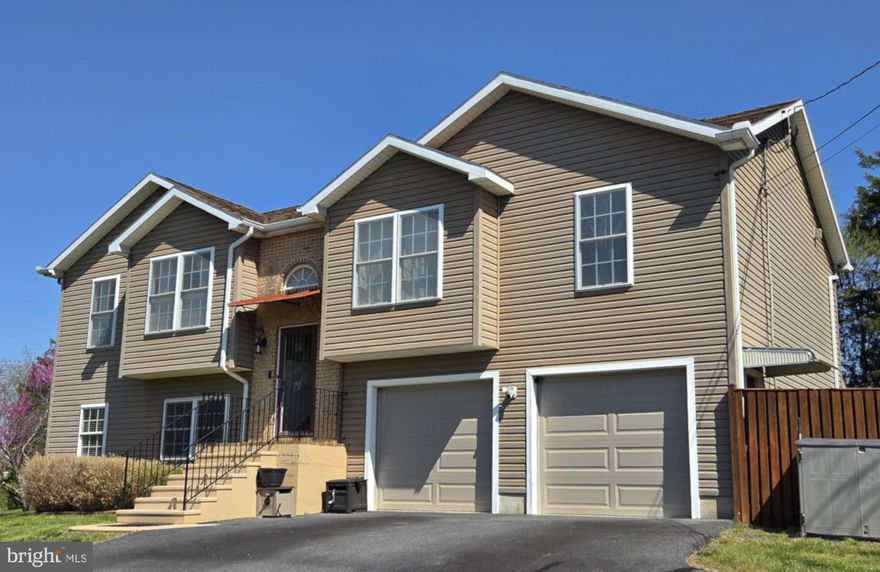 Welcome to this beautifully maintained split foyer home in desirable Bunker Hill, WV, perfectly situated on a spacious 0.81-acre lot with no HOA.
Built in 2007, this impressive home offers 1,992 square feet of thoughtfully designed living space with an open floor plan that’s ideal for both everyday living and entertainment. The main level features gleaming hardwood floors throughout the foyer, stairs, living room, dining area, and kitchen, creating a warm and comfortable feel.
The kitchen is a true highlight, complete with granite countertops, stainless steel appliances, and seamless flow into the dining and living spaces. Just off the dining area, step out onto a large, covered deck—perfect for relaxing or hosting—overlooking the private backyard.
This home offers 3 comfortable bedrooms, 2 full and a half bathrooms, including a well-appointed primary suite featuring a double vanity, tile finishes, and granite countertops for a polished, modern touch.
The fully finished basement expands your living space with a cozy gas stove, a spacious laundry room with a utility sink, and additional flexibility for a family room, home office, or recreation area.
Outside, the fenced backyard provides privacy and functionality, featuring a beautiful, covered deck off of the dining area, a concrete patio and two storage sheds. Those needing extra space will appreciate the oversized, finished 2-car garage.
Combining space, quality finishes, and a peaceful setting, this property offers the perfect blend of comfort and convenience.