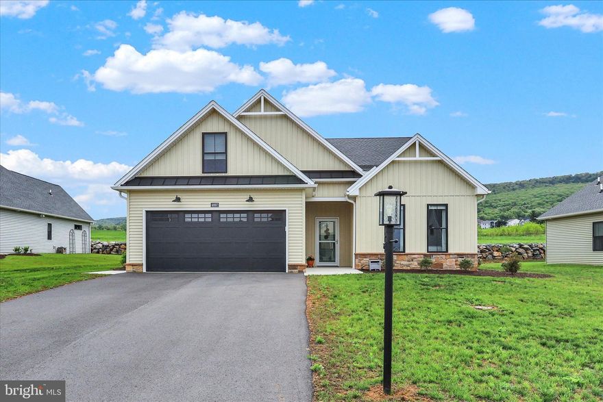 Welcome to The Range HOA neighborhood, part of award-winning Penn National Community! This nearly new home, built in 2023, offers the ease of low-maintenance living combined with thoughtful upgrades throughout. Enjoy convenient one-level living with three spacious bedrooms and two full baths. Highlights include upgraded Hunter Douglas blinds, and a gas stone fireplace with a wood mantel. Accessible from the dining room, relax on the screened rear porch, and additionally, this home has a rear patio with a sitting wall. The kitchen features an apron-front farmhouse sink, under-cabinet lighting, modern light fixtures, and pantry. The hallway bathroom boasts a tiled shower with tub. In the primary suite are dual vanities, walk-in closet, and a step-in tiled shower. Additional features include a front storm door and a side access door from the garage. This home blends comfort and quality in a beautifully maintained community. HOA fee is $145 per month, and covers lawn care, trash, and snow removal. Penn National offers extensive amenities, including 36 holes of 4-star golf, an outdoor pool, tennis/pickleball courts, yoga classes, a community garden, more than 40 social clubs, and a restaurant + bar. For more details on memberships, visit the pro shop!