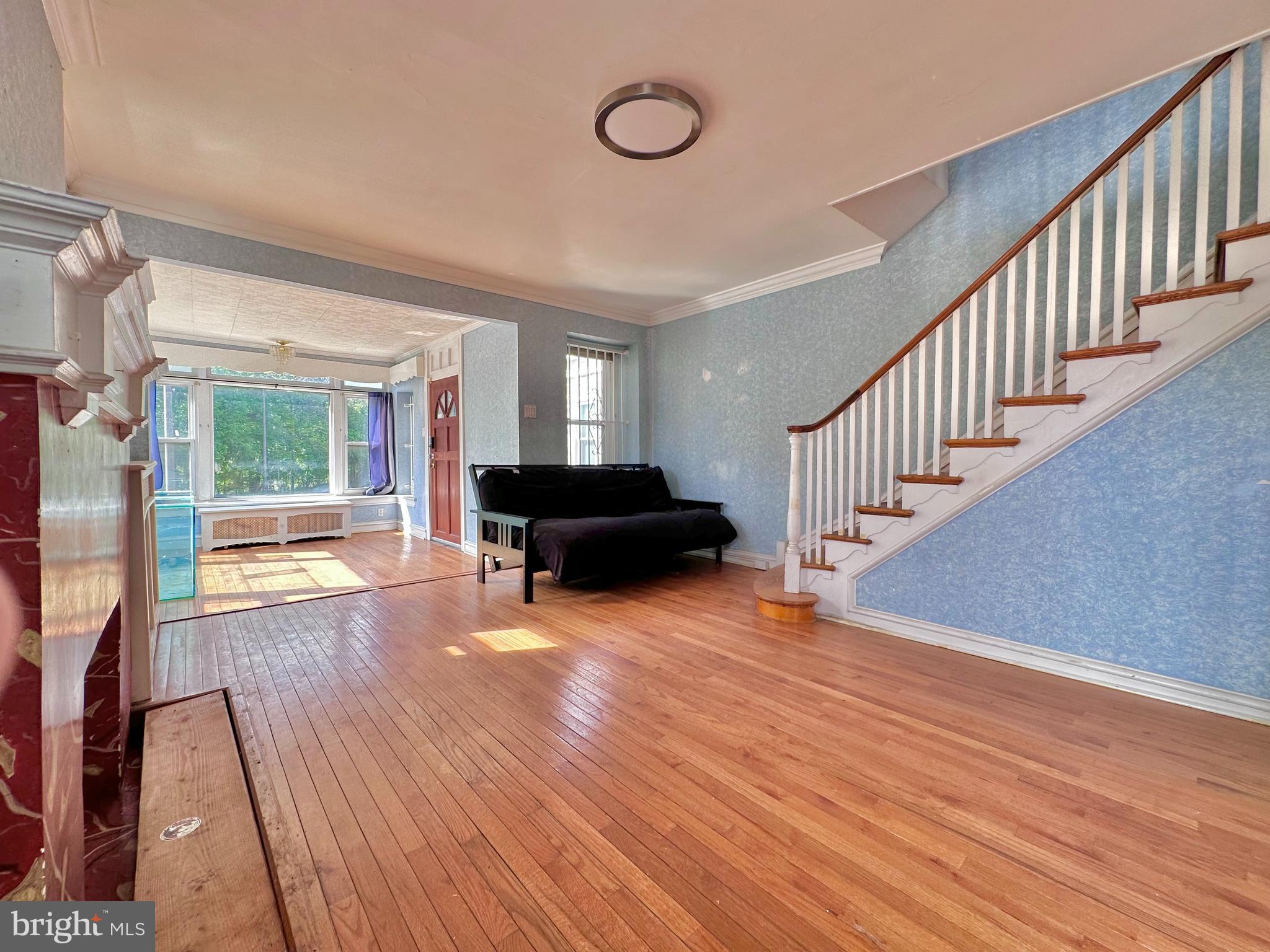 Spacious, sun-filled, corner property with four bedrooms, two full bathrooms, finished basement, and two-car, attached garage. This home boasts gorgeous hardwood floors and original mantle and trim throughout. Large kitchen with central island and gas range stove. Back door leads to a decorative rear patio. Fully tiled finished basement includes full bath with shower/tub combo. Upstairs features four generously sized bedrooms with great closet space and the second full bath with shower and tub combo. The entire home flows beautifully with an excellent layout, large windows, and abundant sunlight.