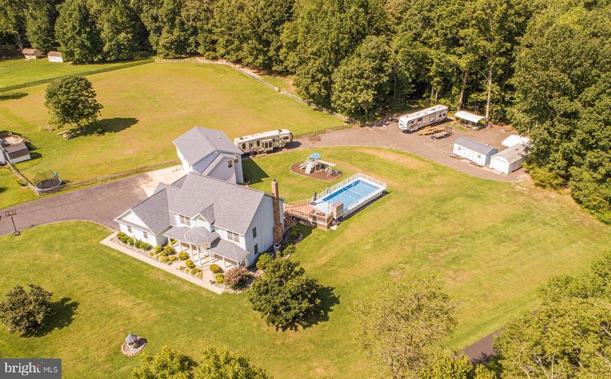 This property will accommodate all your needs!!  Nearly 5000sqft of finished living space and over1800sqft of garage space! No HOA!! Bring your commercial vehicles, RV's, boats and trailers!!  Plenty of space to park it all!!  This beautiful custom built colonial features 4 bedrooms, 2 full baths, and one half bath!  The main level has an updated kitchen with huge island and stainless steel appliances! A separate formal dining room, large family room with wood stove insert, powder room and a laundry room.  A large walk in closet and pantry for plenty of storage.  Upstairs features 4 bedrooms and 2 full baths.  The primary bedroom has a walk-in closet and updated bath!  Basement is fully finished with a huge rec area, additional room that could be used for an exercise room, and a pellet stove! 3 car attached garage and a 3 car detached garage for all your toys! The 3 car detached garage also has an office/apartment overtop.  Great for a business owner or if you wanted to rent it out for additional income, with 1 bedroom (a second potential bedroom or office space), large meeting room or family room area, kitchenette and a full bath!  Lots of amenities outside as well.  This home is great for entertaining with a deck, patio, pool, a nice level yard and plenty of room for parking! Plus two storage sheds! Call today to schedule a tour!