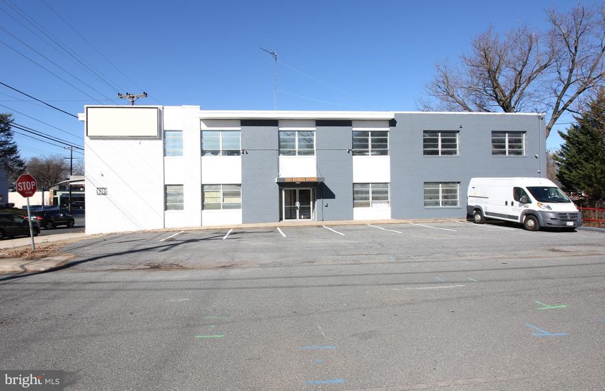 Solid brick corner street two level building with great visibility on Georgia Ave. Private parking for 9 vehicles. Building can be configured for 4 separate units if desired, with two units on lower level and two on upper level. The parking area includes a loading dock. Roof less than 6yrs old...