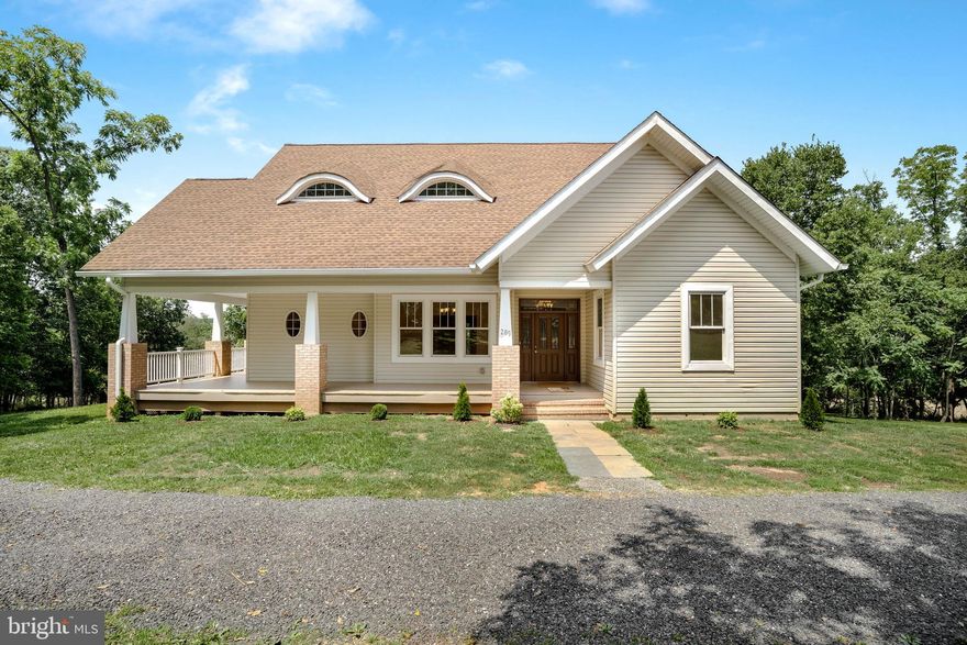 Welcome to the "eyebrow" house in the quiet peaceful Quicksburg neighborhood. This home was custom designed by a local architect  with its distinct eyebrow 2nd story windows. Come and enjoy the views while relaxing on the wrap around front porch. The first floor primary bedroom and bathroom is off to the right rear and  provide a great  deal of privacy. There is a den/ office on the front corner ready for your home business or classroom. The Livingroom has built in cabinets the surround the fireplace. The kitchen has all the room to show off your gourmet skills with its kitchen island and adjoining breakfast room. The laundry and half bath are located opposite the kitchen.  The upstairs has a full bath that includes two vanities and private toilet room.  The two end bedrooms are huge. Lots of storage space designed in them. The center bedroom offers sweeping views over the lush greenery of the property's 4.04 acres.