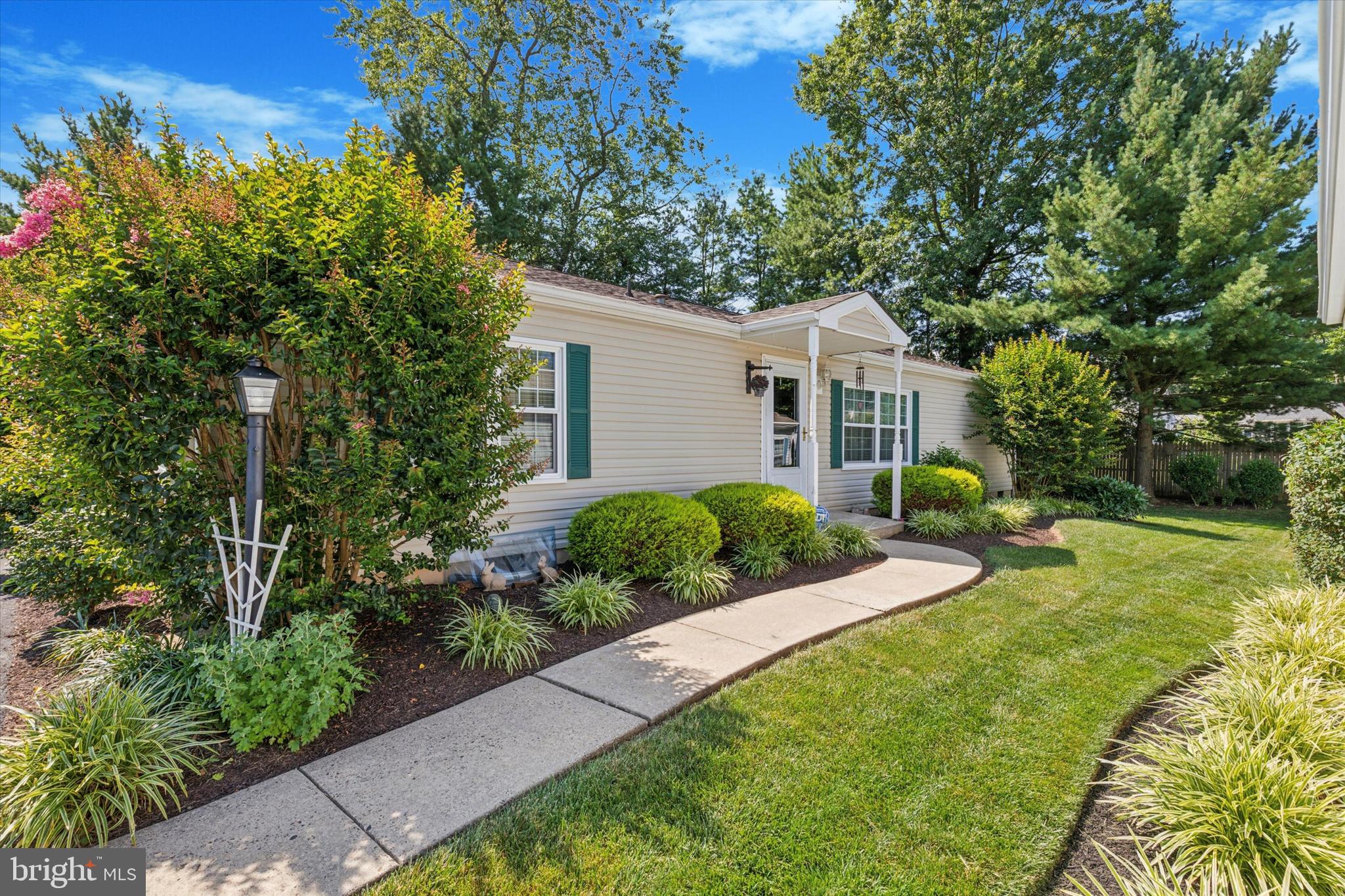 Welcome to 1095 JFK Drive, a 3 bedroom, 2 bath ranch-style home in the highly desirable Gwynedd Woods 55+ community. This thoughtfully designed home offers a spacious and open layout, perfect for everyday comfort and entertaining. Inside, you’ll find hardwood floors, newer windows, and an updated kitchen with ample cabinet space. The living and dining areas connect seamlessly to the kitchen, creating a central gathering space filled with natural light. The primary bedroom features a private bath and generous closet space, while two additional bedrooms provide flexibility for guests, a home office, or hobbies. Step outside to a private deck—a peaceful retreat to enjoy your morning coffee or relax in the evening. Additional highlights include main-level laundry and low-maintenance living in a well-maintained community close to shopping, dining, and local amenities. Gwynedd Woods offers a low HOA fee, no land lease, and access to a community clubhouse with a variety of year-round activities.