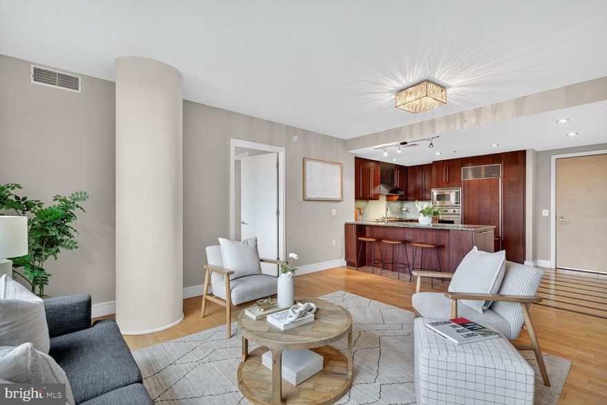 Price just reduced, and interest rates are at or near recent lows - time to move on this beautiful home!  Bright and sunny 2 bedroom, 2 bathroom condominium with stunning Potomac River views and high-end, upgraded finishes at The Odyssey in Court House.    Your future home includes a primary suite with two large walk in custom closets, and large bathroom with double vanity, jacuzzi tub and separate glassed in shower.  Second bedroom also has a walk in closet and its own adjacent bathroom.  Hardwood floors in living areas, soft carpet in bedrooms and Southern exposure.  Kitchen includes Wolf cook top and Subzero refrigerator.  Full service building amenities include: 24-hr front desk, building engineer and maintenance, roof top pool and terrace with grills and panoramic monument views, elegant party lounge club room with pool table, business center/conference room, sauna, large penthouse gym and storage units for rent.  Washer/dryer in unit, and assigned garage parking!  2 short blocks to Court House Metro station and walk to many restaurants, shops and gyms.  And only a 10 minute walk to either Rosslyn or Clarendon, and its Trader Joes and Whole Foods, along with Ballston, and easy access to highways to DC, Tysons and beyond.