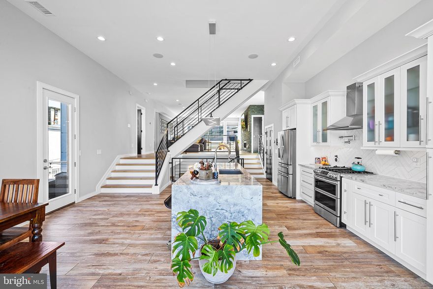 Meticulously designed, constructed and maintained, fully detached, 26 foot wide, 3bed/4bath (2 full, 2 half), 3200 sqft, smart home with soaring ceilings, great sunlight, walkout basement, 3 exceptional outdoor spaces, two car garage, and +/- 5 years remaining on the (full 100%) tax abatement! Welcome to 266 Krams Ave, a luxurious, technology enabled, custom built home located in the highly desirable Manayunk/Roxborough neighborhood of Philadelphia. Built by an award-winning Philadelphia builder for him and his family, this stunning property is one of the only fully-detached houses with a two car garage, walk-out basement, massive backyard and side yards, and multiple outdoor spaces on all levels for you and your family to enjoy. As you enter the home, you'll be struck by the spacious and thoughtful design, which includes a spacious entry-way with plenty of storage. The placement of the windows was designed around sunlight and airflow, allowing you to enjoy natural light throughout the day, and the direct vented gas fireplace in the living room offers the perfect vantage point for watching the sunset each evening. The home is equipped and fully technology enabled with 10 zones of in-wall speakers and exterior speakers, lighting that can be controlled from the touch of a built-in iPad or from your phones app, as well as, a pull-out coffee station in the pantry, and an outlet behind the vanity for a hidden blow dryer.  The large eat-in kitchen is equipped with custom cabinets, Samsung appliances, and a built-in breakfast nook, making it the perfect space for hosting dinner parties or intimate gatherings. Sliding doors lead out to a spacious back deck, complete with a table, fire pit, and BBQ, making it the ideal spot for outdoor dining. Upstairs, you'll find three bedrooms, each with ample closet space, including a serene master bedroom with vaulted ceilings, floor-to-ceiling windows, and two separate walk-in closets. The en-suite bathroom is a true oasis, with heated floors, separate vanities, a toilet room, and an oversized walk-in shower with three shower heads and bench seating. And if you're looking for a private spot to soak up the sun, head up to the large roof deck, where you can enjoy breathtaking views of the city skyline while listening to your favorite music. Located on a small, quiet street that leads to a dead-end for cars, this home offers peace and privacy. Just a few steps away, you'll find stairs that lead down to Silverwood street and then just a short walk to Pretzel Park, Main Street, and more. If you walk up towards Roxborough, you'll be very close to Gorgas Park and restaurants like New Ridge Brewery. This property is also conveniently located just minutes from I-75, I-676, I-95 and public transportation, making it ideal for commuters. And with local parks, pools, shops, and restaurants just a short walk away, you'll have everything you need right at your fingertips. Don't miss this opportunity to own a luxurious home in one of Philadelphia's most sought-after neighborhoods. Schedule a private tour and experience the best that Philadelphia has to offer. PLEASE NOTE: carpet in bedrooms was replaced with hardwood in February 2025.