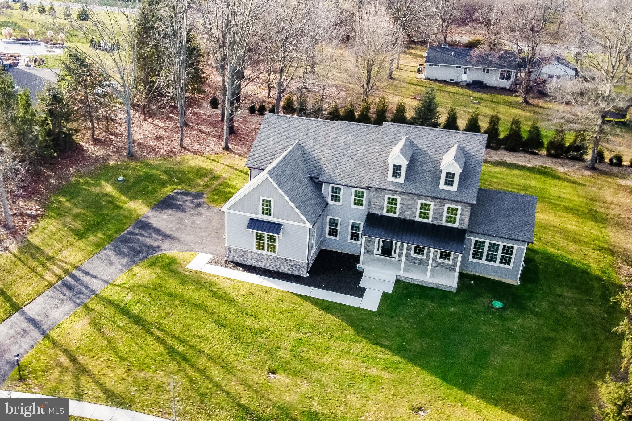 NEW CONSTRUCTION in Doylestown, Buckingham Township. Build an exquisite 4-bedroom, 3.5-bathroom home designed to meet the demands of modern living. Situated on over an acre of land, the property is enveloped by a protected 6-acre wooded wonderland, offering unparalleled privacy and tranquility.
Just 4 miles from the vibrant center of Doylestown Borough, where residents enjoy charming shops, diverse dining options, rich cultural experiences: the Mercer and James Michener Art Museums, Fonthill, and more!
To be built by an outstanding custom builder, Webb Building Group, your home's floor plan will be tailored for your lifestyle. A few special features of pictured home: Kitchen/Breakfast Rm. - a 9 ft island, a walk-in & a Butler pantry; Bonus Rm. - 260 sq ft of flex space - a sunroom, a "play room" for kids/adults; a music room, etc.! Floors are hardwood; Ceilings are 9 ft. A Primary Suite with tray ceiling, sitting room, 2 walk-in closets, a double closet, huge bath w/oversized shower, separate elegant tub w/beautiful view of surrounding forest. There are 3 additional bedrooms, one is ensuite and the other two share a "jack and jill" bath. Large 2nd fl laundry room. Home is high lighted by "Webb's Signature Trim Package". Exterior has a striking front elevation, charming front porch with metal roof, stone and 5" panels. Attached 3-car garage.
Webb Building Group will make changes to the current presented floor plan, and encourage you to bring your own plan. They will help you custom design your home!
Located across from George M. Bush Park, this private residence is a rare find in a small-town setting. Don't miss the opportunity to own this exceptional property.