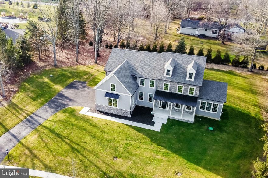 NEW CONSTRUCTION in Doylestown, Buckingham Township. Build an exquisite 4-bedroom, 3.5-bathroom home designed to meet the demands of modern living. Situated on over an acre of land, the property is enveloped by a protected 6-acre wooded wonderland, offering unparalleled privacy and tranquility. 

Just 4 miles from the vibrant center of Doylestown Borough, where residents enjoy charming shops, diverse dining options, rich cultural experiences: the Mercer and James Michener Art Museums, Fonthill, and more!   

To be built by an outstanding custom builder, Webb Building Group, your home's floor plan will be tailored for your lifestyle. A few special features of pictured home: Kitchen/Breakfast Rm. - a 9 ft island, a walk-in & a Butler pantry; Bonus Rm. - 260 sq ft of flex space - a sunroom, a "play room" for kids/adults; a music room, etc.! Floors are hardwood; Ceilings are 9 ft. A Primary Suite with tray ceiling, sitting room, 2 walk-in closets, a double closet, huge bath w/oversized shower, separate elegant tub w/beautiful view of surrounding forest. There are 3 additional bedrooms, one is ensuite and the other two share a "jack and jill" bath. Large 2nd fl laundry room. Home is high lighted  by "Webb's Signature Trim Package".  Exterior has a striking front elevation, charming front porch with metal roof, stone and 5" panels.  Attached 3-car garage.

Webb Building Group will make changes to the current presented floor plan, and encourage you to bring your own plan. They will help you custom design your home! 

Located across from George M. Bush Park, this private residence is a rare find in a small-town setting. Don't miss the opportunity to own this exceptional property.
