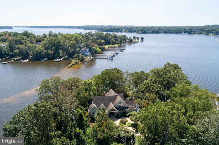 Beautiful, private setting on peninsula overlooking the Magnificent Severn River.  This gracious home features an elegant entry foyer and covered front porch.  Vaulted and cathedral ceilings, lots of glass to take advantage of the fabulous views from the many windows.  Formal living and dining area, Island kitchen,
features upgraded appliances-Sub zero refrigerator, six burner gas range, additional wall oven. Elegant cabinets,  adjacent breakfast room overlooks water and stone patio with water fall.  Extensive plantings.  The "Great Room" is the ideal spot for a warm and cozy winter evening in front of the fireplace.  A sun room offers a great place to relax, read a book, or just enjoy the views and abundant birds and wildlife.  A first floor master suite is surrounded by windows, vaulted ceiling and bath designed to pamper one's self!  Upper level features a library, family area and additional room (unfinished for addition bedroom, etc. and 
piping for future additional bath.
Lower level bedrooms, bath and lots of storage area.  Bonus room over garage has possibility for many uses.  Also features electric, heat, 3 skylights and windows.
Private pier/dock with four slips. 10,000 lb. boat lift. Jet ski lift.
Whole house generator.
Beautiful setting on the Severn River and Yantz Creek.  Sandy beach.  Garage with workshop.
Fireplace screen, andirons and hearth "fence" excluded- Family heirloom. Sale contingent upon seller having ratified contract of sale on house of choice within 45 days.