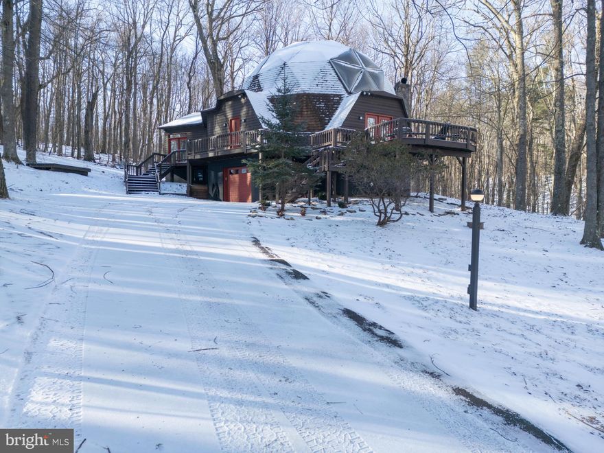 Opportunity to own one of Deep Creek Lake's most unique homes! 621 Paradise Heights is a geodesic dome house offering 4 bedrooms, 3 full bathrooms and over 4300 square feet of interior space. Become the ultimate host of guests with the many entertainment spaces in the house including main level living room, parlor with wet bar, expansive deck, stacked stone fireplace, fit pit in back yard and more. The Paradise Heights location offers close proximity to all of the essential destinations and amenities you are looking for when you come to the lake with a private feel tucked into the hillside. Whether you are looking or a second home, vacation rental investment or primary residence, this home could be exactly what you are looking for. Call today to schedule a private showing!