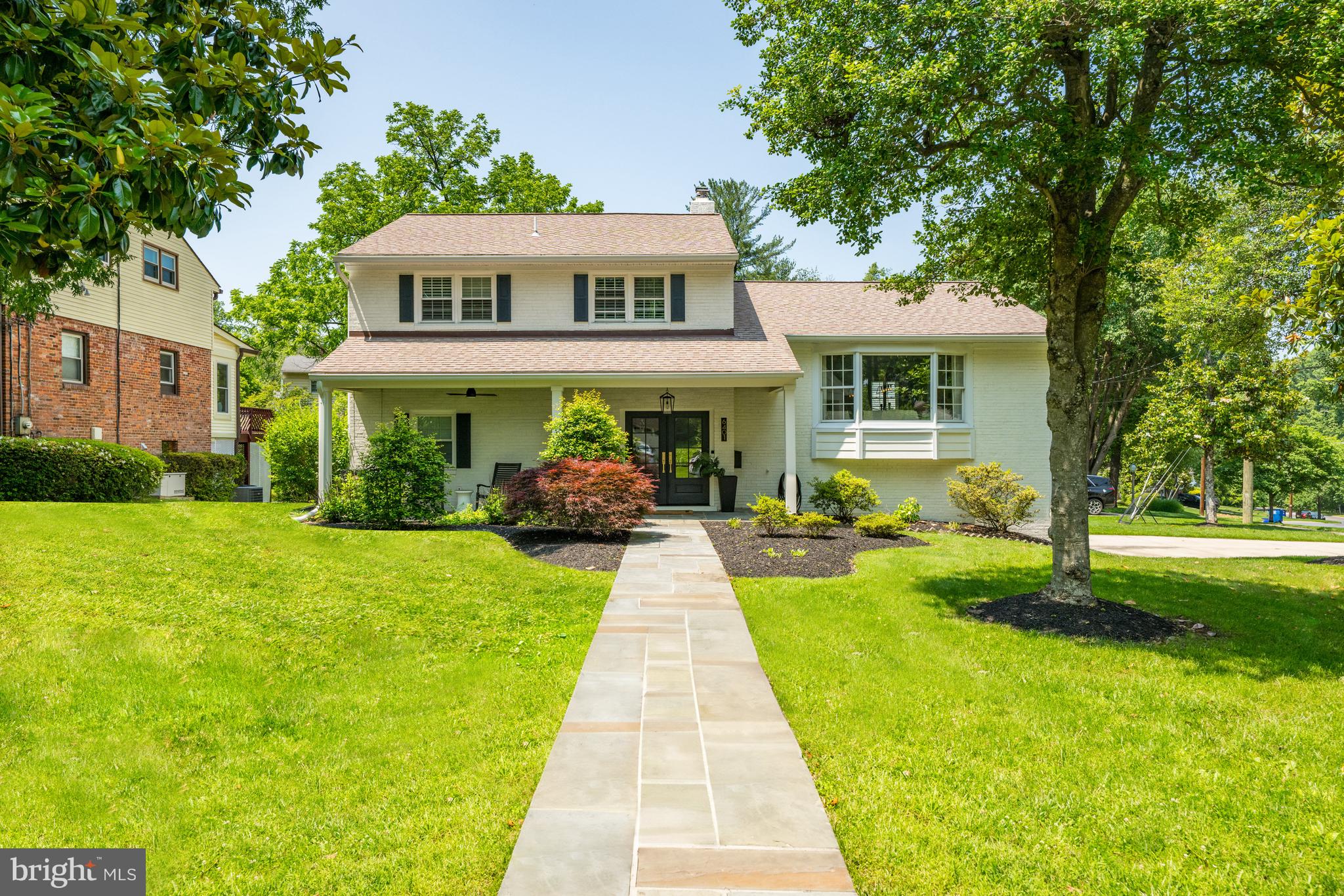 Welcome to 6401 Crane Terrace – a beautifully updated split-level home nestled in the sought-after Woodhaven neighborhood of Bethesda, Maryland. This home has been extensively renovated to offer the modern, open-concept layout that today’s lifestyle demands.
Follow the slate walkway to the double front doors, where a charming porch invites you to sit and relax—complete with a ceiling fan and chic light fixture. Step into the spacious, modern foyer—setting the tone for the stylish design and thoughtful updates found throughout the home. The main level offers a stunning open floorplan that immediately impresses with its sleek, contemporary finishes. The show-stopping kitchen features a custom tile backsplash, an expansive island with bar seating, a gas range, floor-to-ceiling cabinetry, and a dedicated coffee and beverage bar with its own refrigerator—perfect for both entertaining and everyday living. The living area is filled with natural light streaming through oversized windows, while rich hardwood flooring flows seamlessly throughout the level.
Continue to the upper level, where three spacious bedrooms and two full bathrooms await. The primary suite features an en-suite bathroom, a dedicated vanity area, and a converted bedroom that now serves as a highly functional walk-in closet and office combination. Down the hall, you will find an additional bedroom and a full bathroom with a shower/tub combination.
The entry level features a versatile bonus living area enclosed by stylish barn doors, complete with a cozy wood-burning fireplace, a storage closet, and direct access to the spacious sunroom. Wrapped in tile flooring, the sunroom offers a bright and inviting space with convenient access to the kitchen just a few steps up. A fourth bedroom can be found on this level, adjacent to a full bathroom with a custom-tile walk-in shower.
Step outside to a fully fenced backyard featuring both a grassy yard and an oversized patio—ideal for outdoor dining, entertaining, or relaxing around a firepit. The garage offers flexible use as an at-home gym, while a bonus lounge space near the lower-level laundry room adds even more versatility. Situated on a generous corner lot, this home offers quick access to downtown Bethesda and is just minutes from I-495, making the location as convenient as it is desirable. With so much to offer, this exceptional home won’t last long—don’t miss your chance to lease it today.